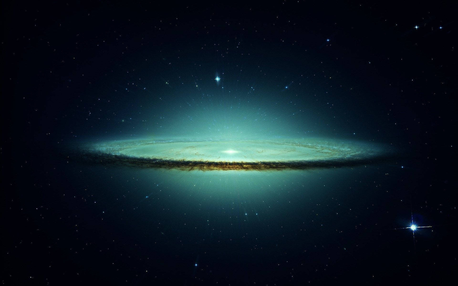 Star Space 桌布 壁紙 — 一個發光的螺旋星系，帶有藍綠色旋臂和金色塵埃漩渦，在宇宙夜空下的星場中閃耀。
