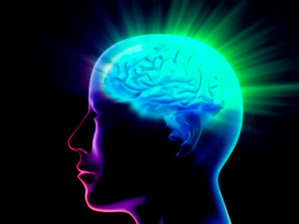 Brain 桌布 壁紙 — 一個發光的霓虹大腦在人類剪影內脈動，背景為黑暗，帶有輻射光束。
