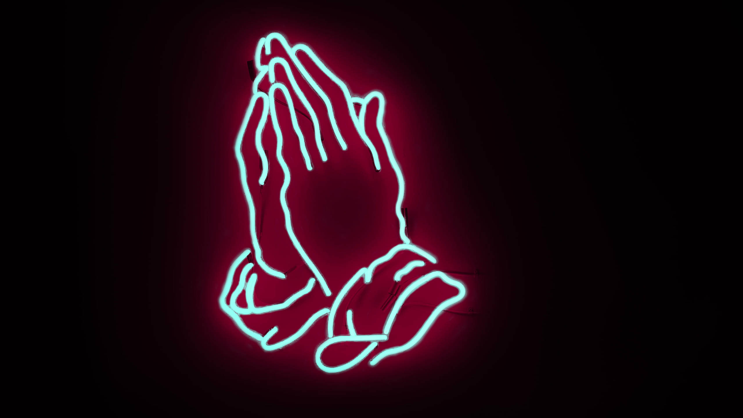 Drake 桌布 壁紙 — 一個發光的霓虹燈牌，描繪雙手合十祈禱，背景為深色帶有粉紅色光芒。