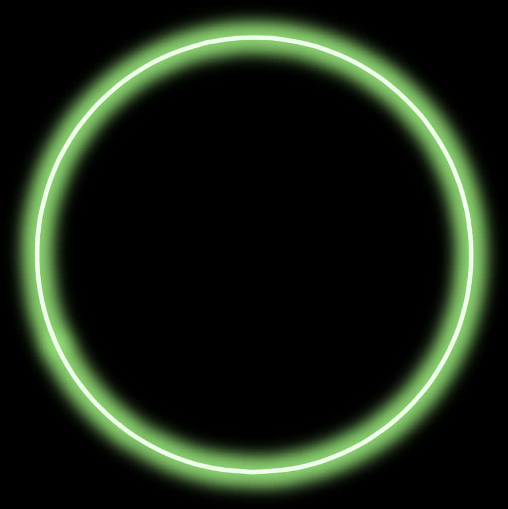 Circle Shape 桌布 壁紙 — 一個發光的霓虹綠色圓形環在純黑色背景上柔和地散發光芒。