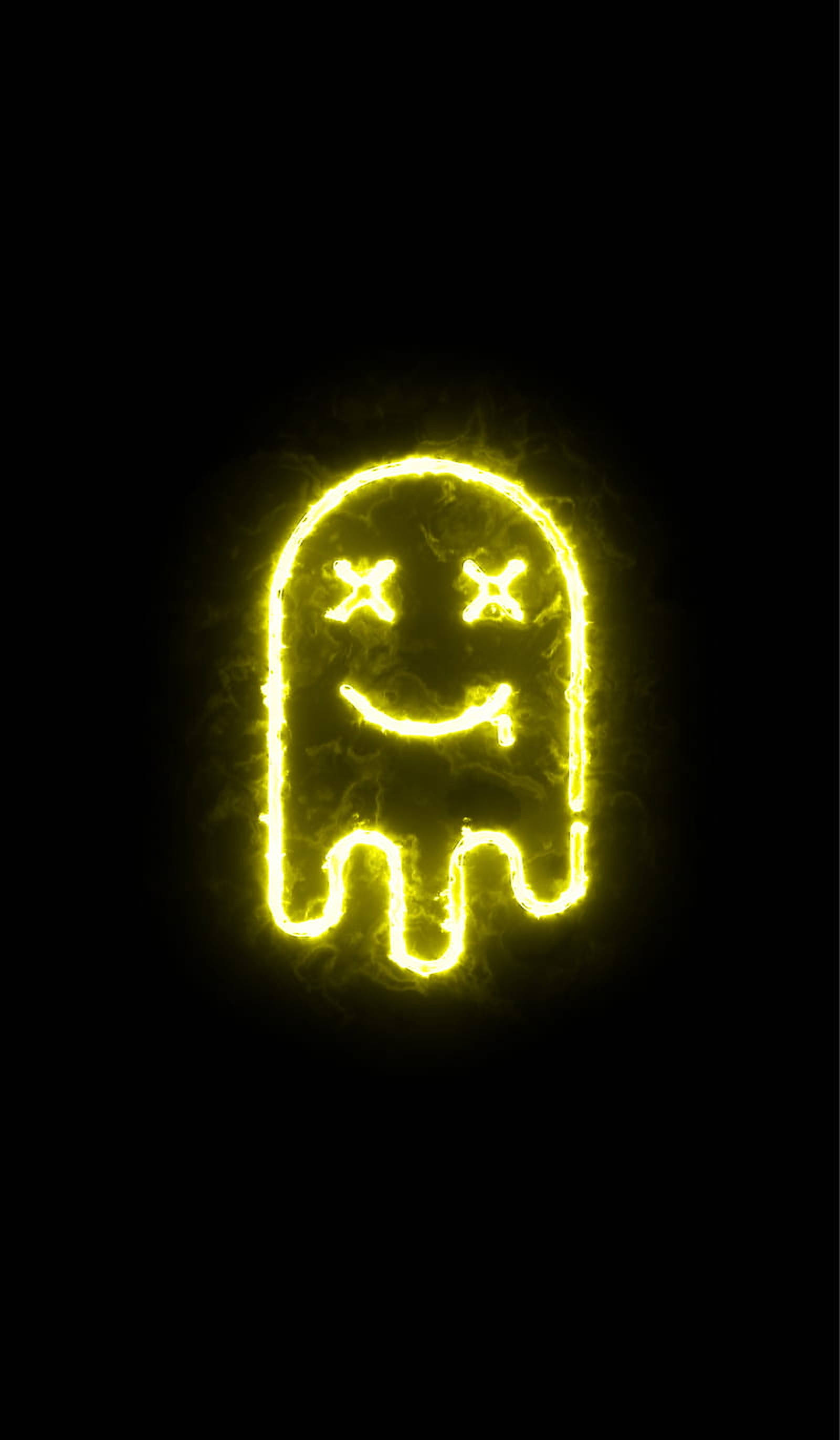 LED 桌布 壁紙 — 一個發光的黃色 Pac-Man 鬼魂，帶有 X 眼睛和微笑，在黑色背景上閃耀。