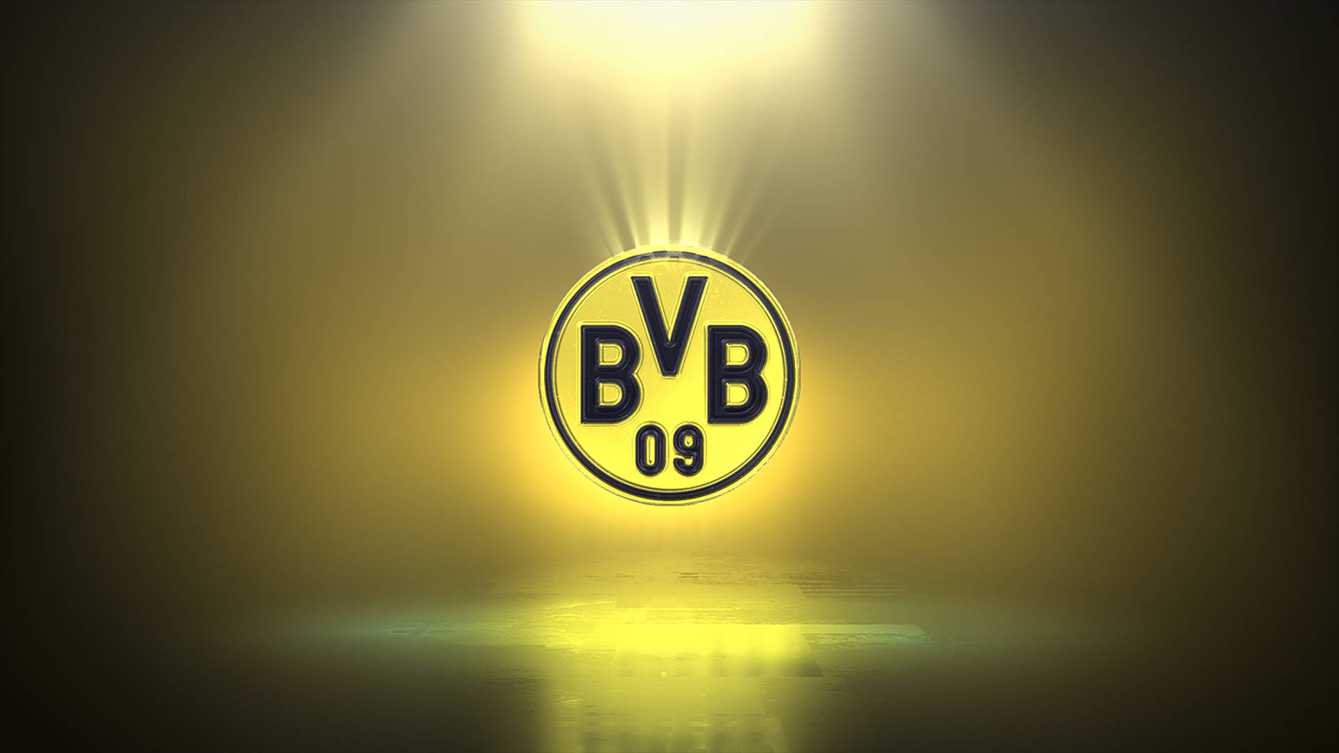 Dortmund 桌布 壁紙 — 一個發光的黃色多特蒙德標誌，在黑暗舞台上被聚光燈照亮，地板具有反射效果。