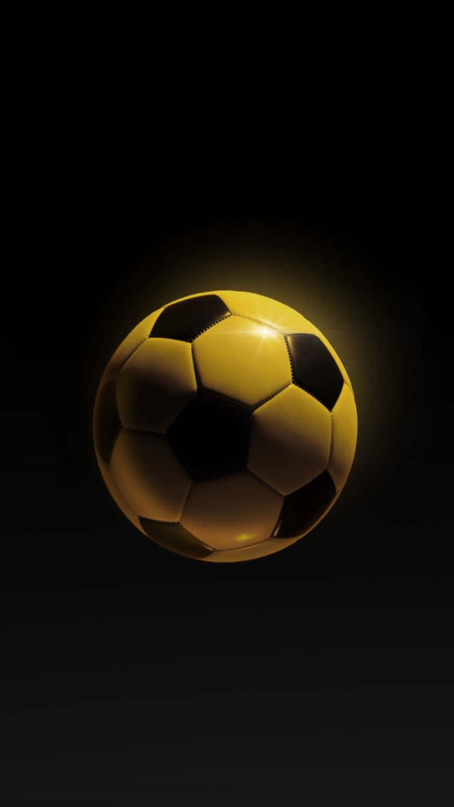 Soccer Ball 桌布 壁紙 — 一個發光的黃黑足球漂浮在黑暗背景上，表面散發出柔和的光芒。