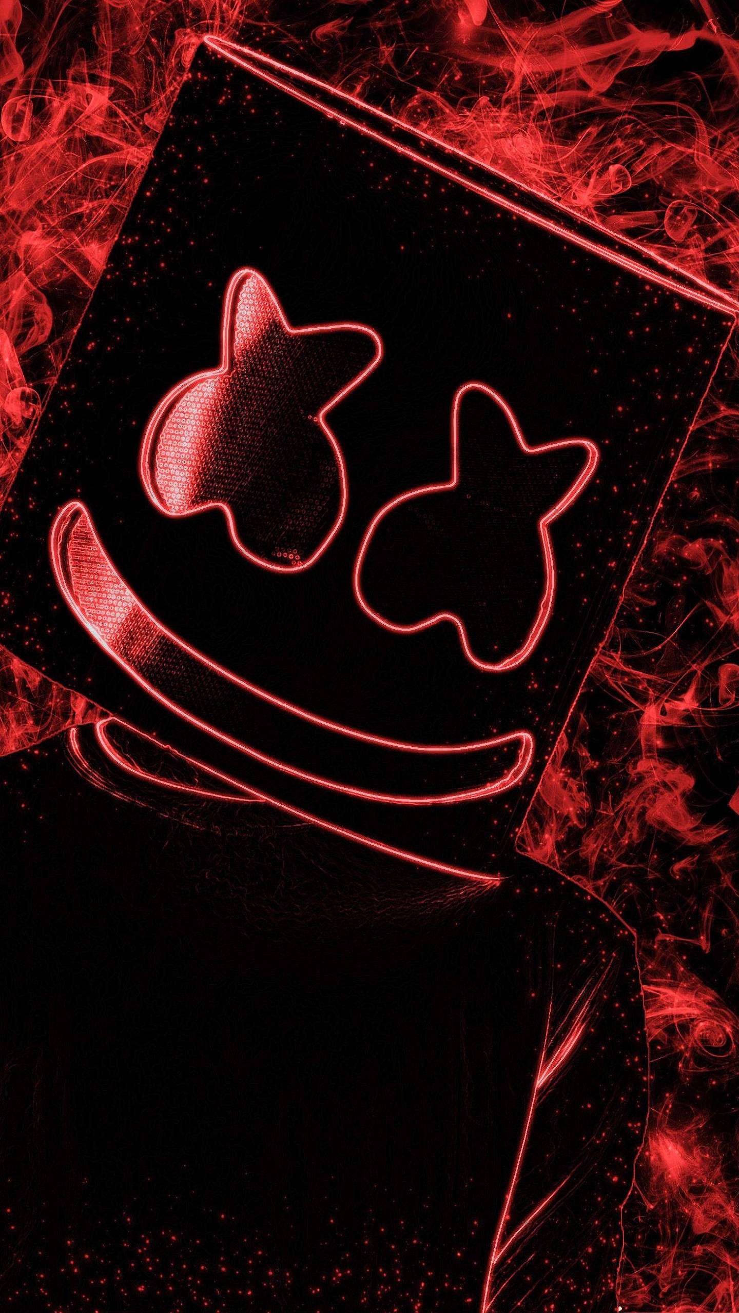 Marshmallow Dj 桌布 壁紙 — 一個發光紅色輪廓的微笑面具，帶有星形眼睛，背景為黑暗煙霧繚繞。