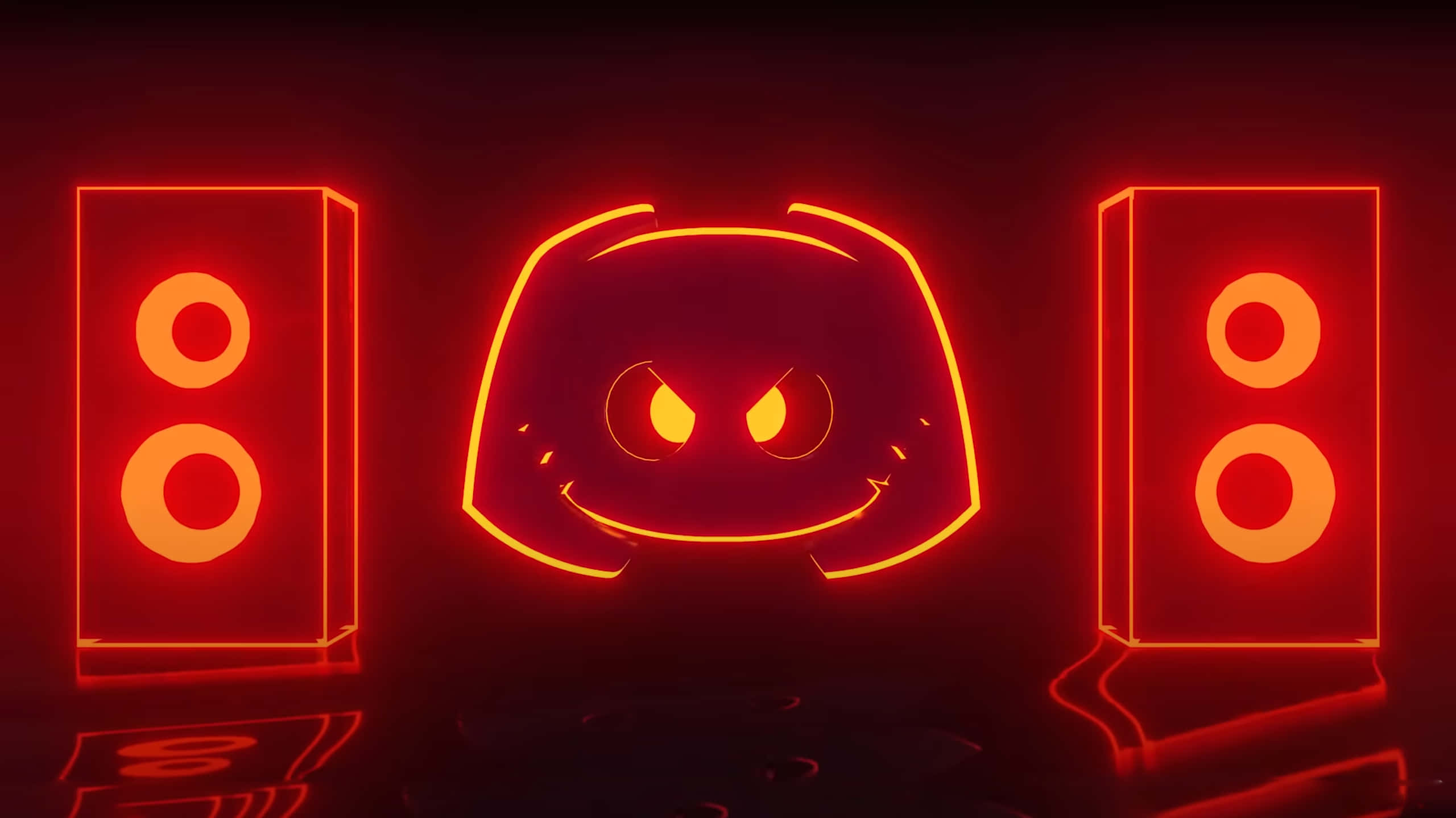 Discord Logo 桌布 壁紙 — 一個發光紅色霓虹燈Discord標誌，帶有憤怒的眼睛，兩側有兩個揚聲器，在黑暗的房間中。
