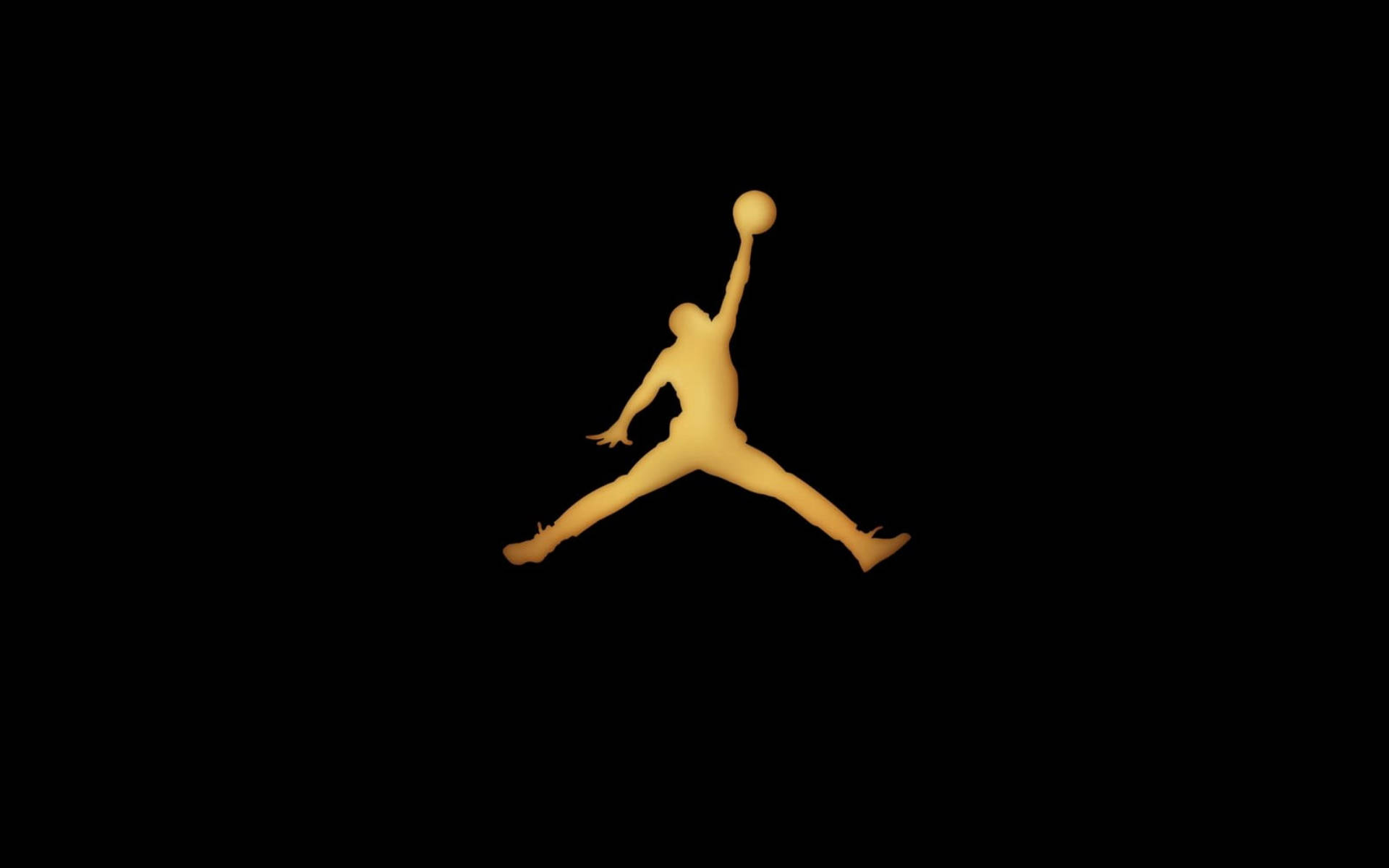 Jordan Logo 桌布 壁紙 — 一個發光金色剪影，描繪籃球運動員在半空中灌籃，背景為純黑色。