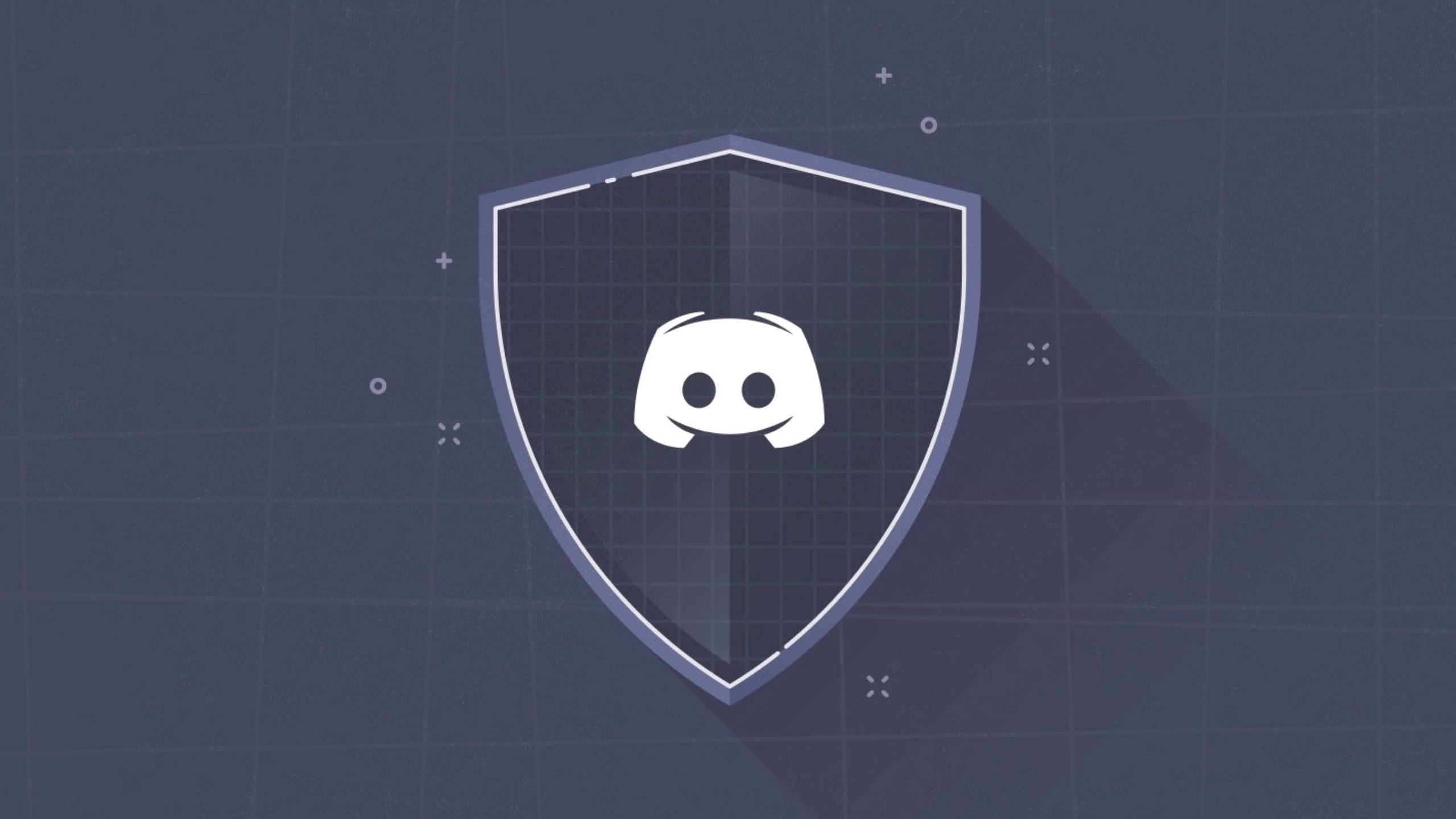 Discord 桌布 壁紙 — 一個白色 Discord 標誌置中於盾牌內，背景為深藍色網格，帶有微妙的幾何裝飾。