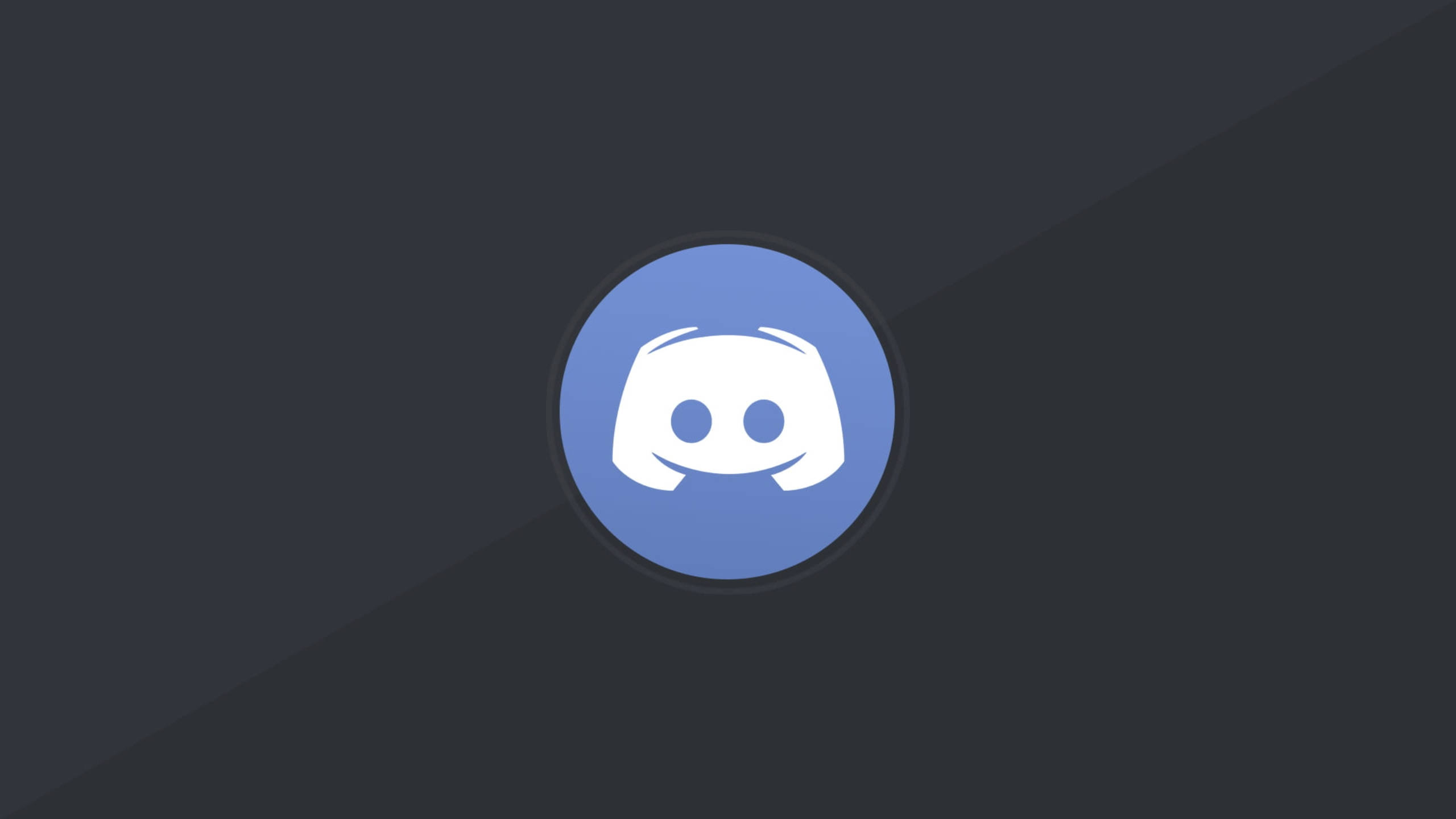 Discord 桌布 壁紙 — 一個白色 Discord 標誌置中於藍色圓形內，背景為深灰色斜向漸變。