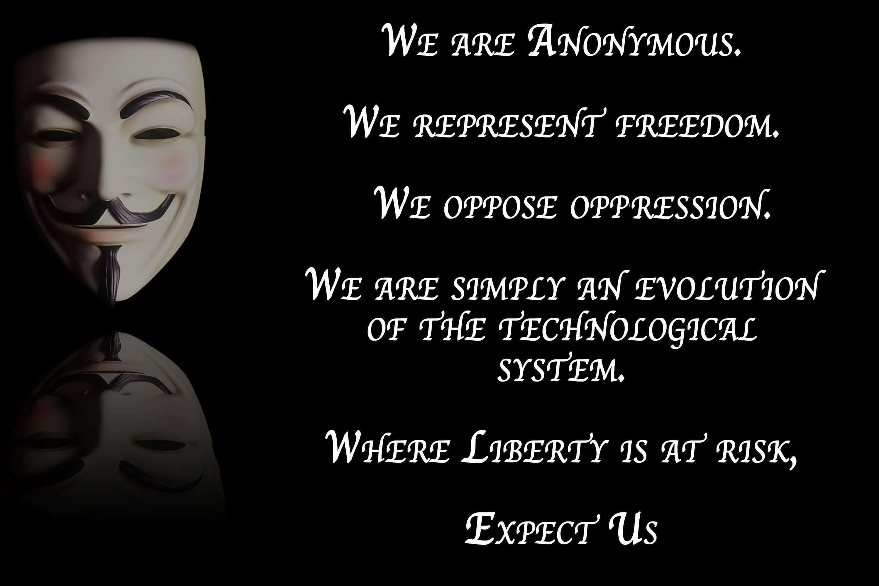 匿名 桌布 壁紙 — 一個白色 Guy Fawkes 面具，上面有文字宣示匿名、自由和反對壓迫，背景為黑色。