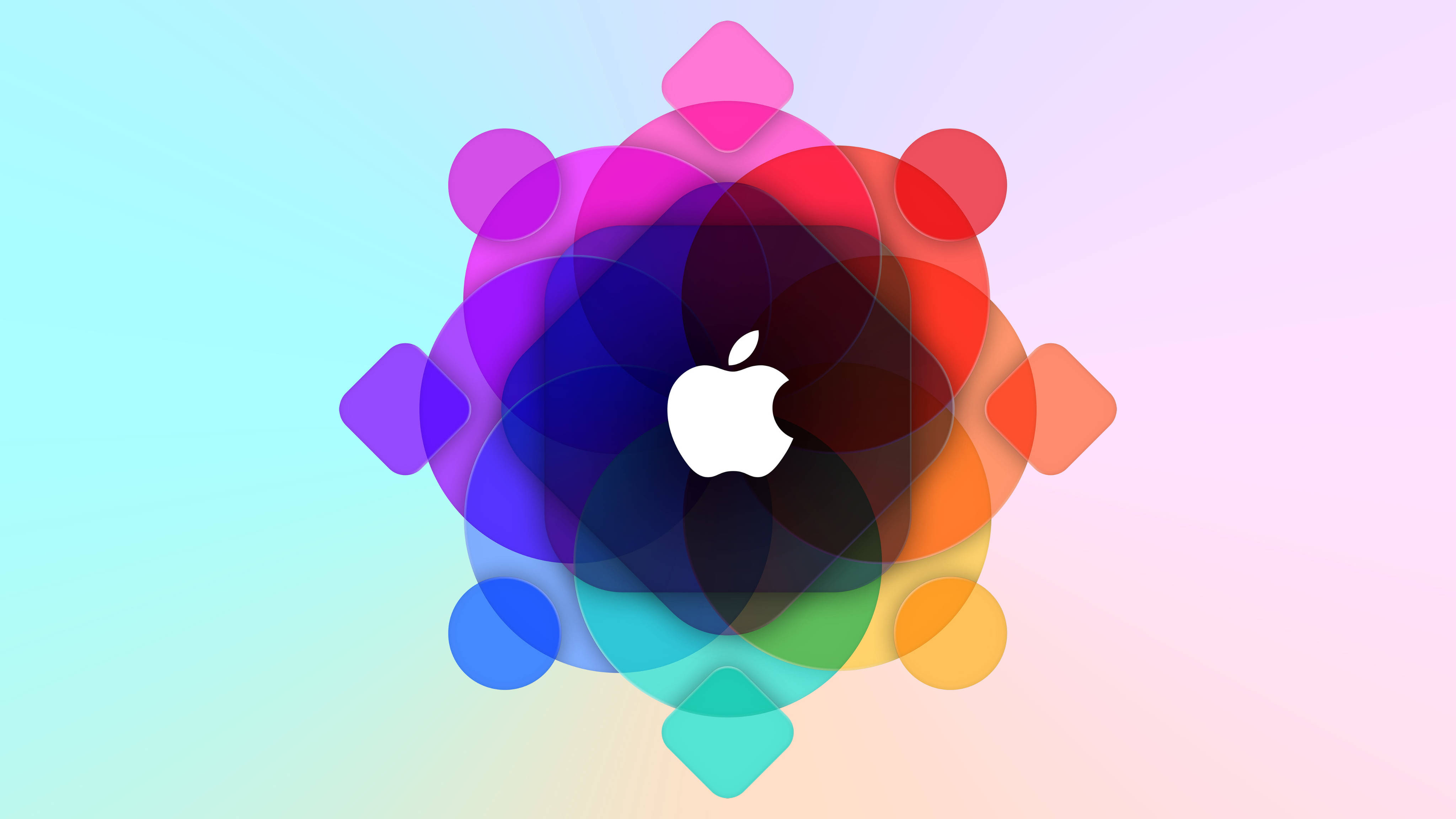 Apple 4K Ultra HD 桌布 壁紙 — 一個白色Apple標誌居中於一個充滿活力的重疊圓形和菱形色彩輪內，背景為柔和漸變色。