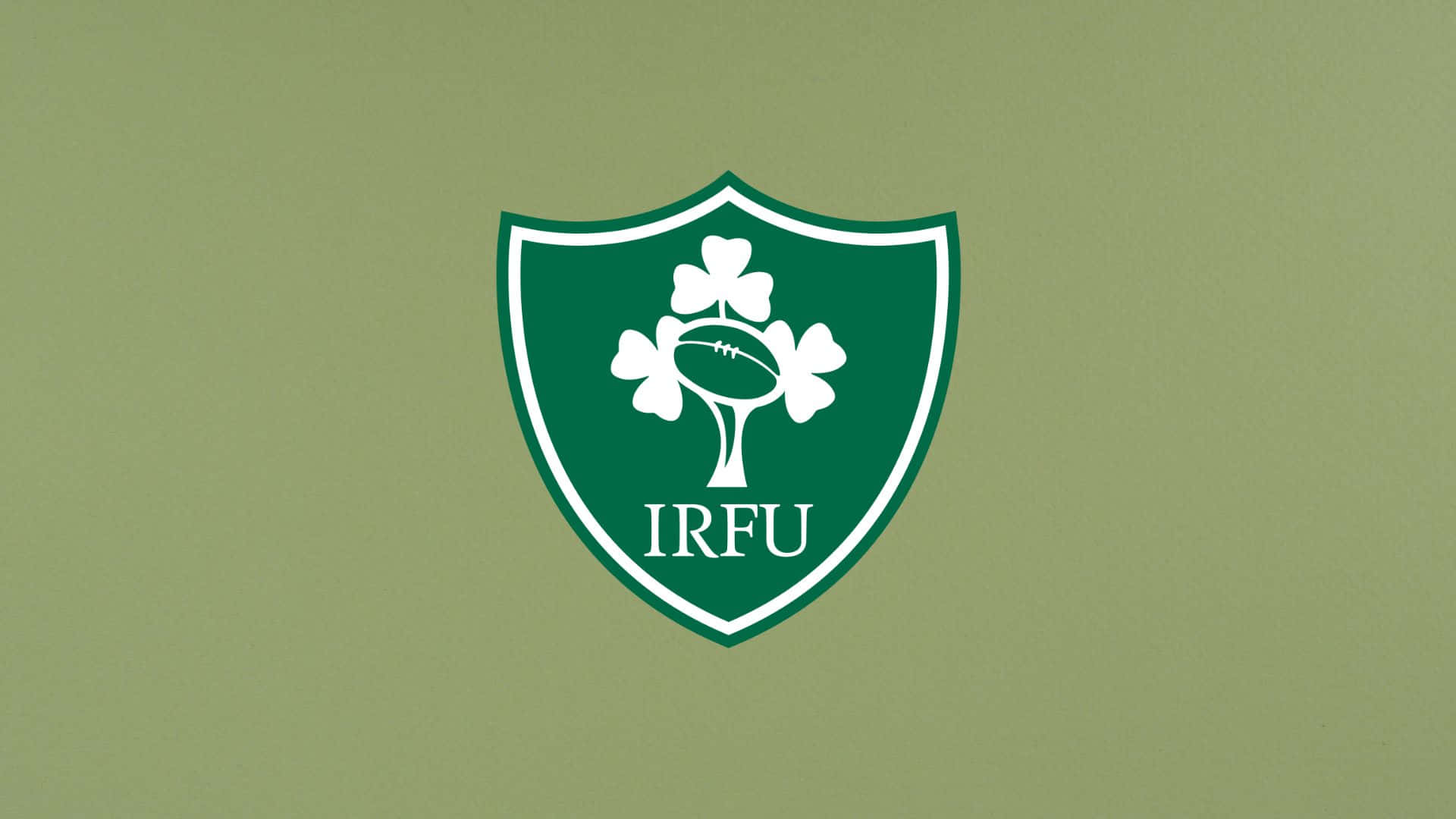 Ireland Rugby 桌布 壁紙 — 一個白色IRFU盾牌標誌，中央有一棵三葉草樹和一個橄欖球，置於純橄欖綠色背景上。