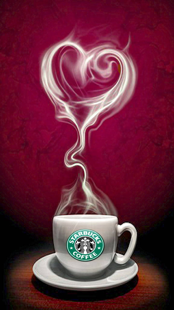 Starbucks咖啡杯，心形蒸氣從中升起，放在木桌上。 — 咖啡動圖 壁紙