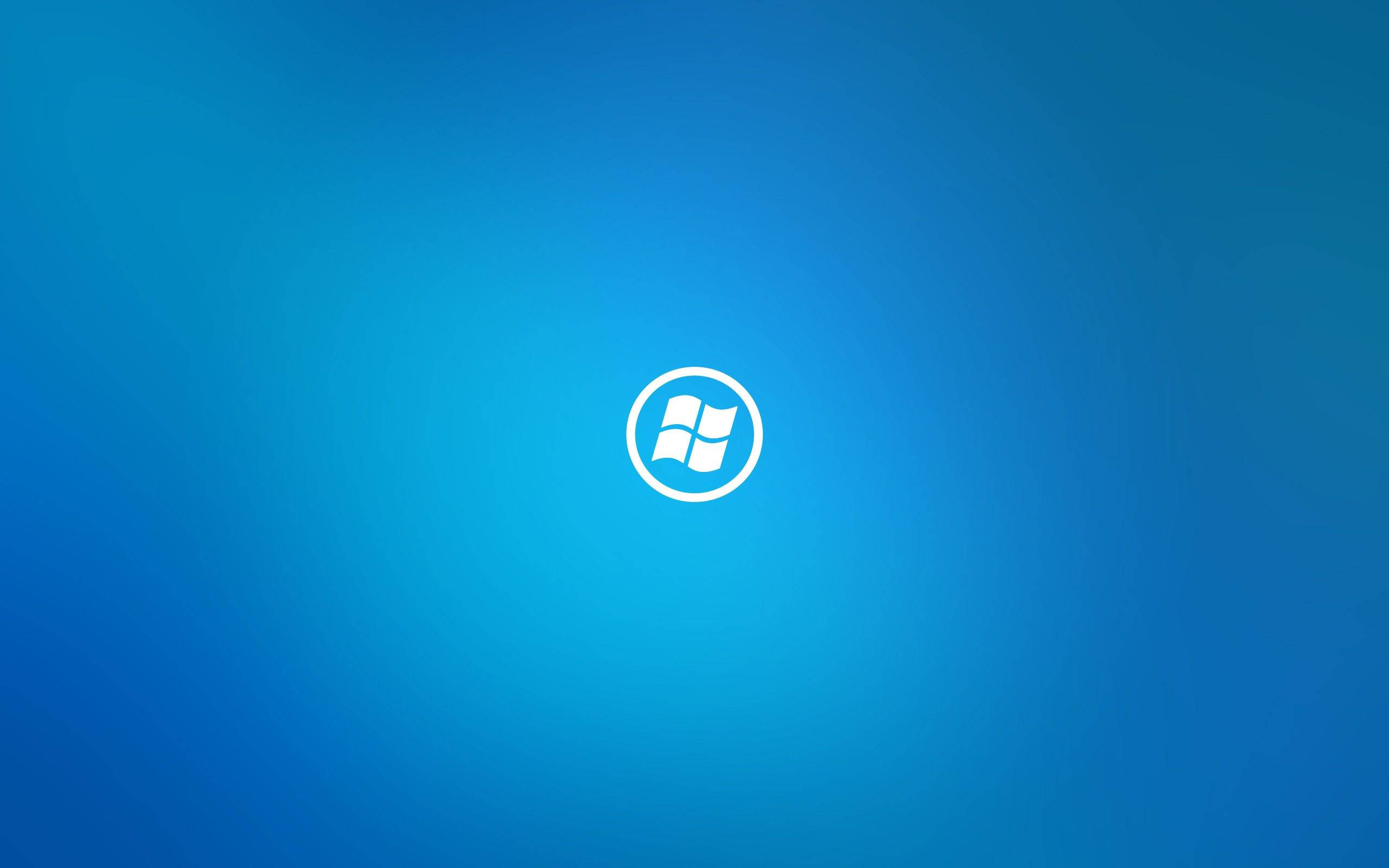 Windows 10 桌布 壁紙 — 一個白色Windows標誌居中於漸變藍色背景上。
