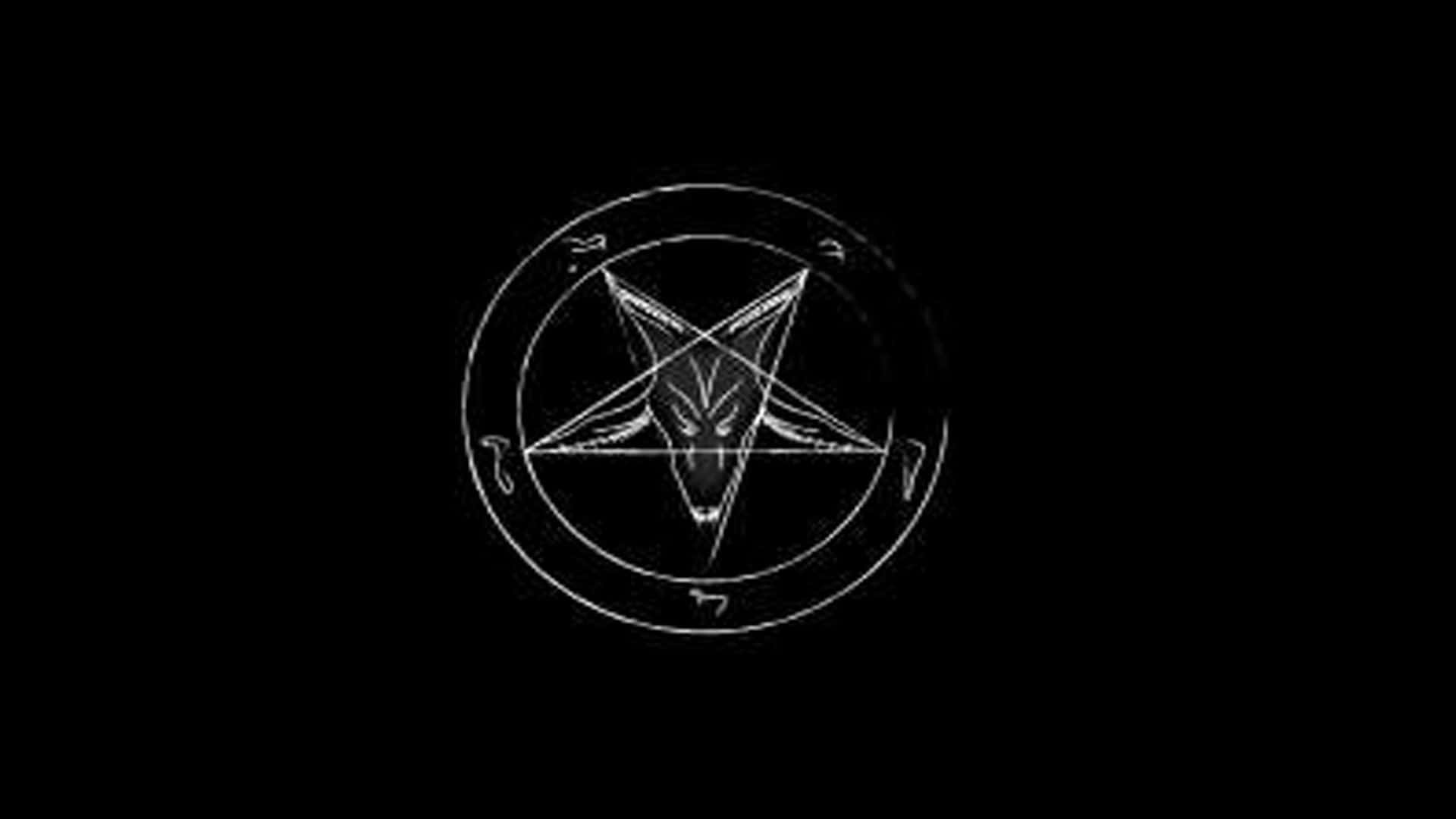 Occult 桌布 壁紙 — 一個白色五角星，內有山羊頭圖案，位於圓圈內，背景為黑色。