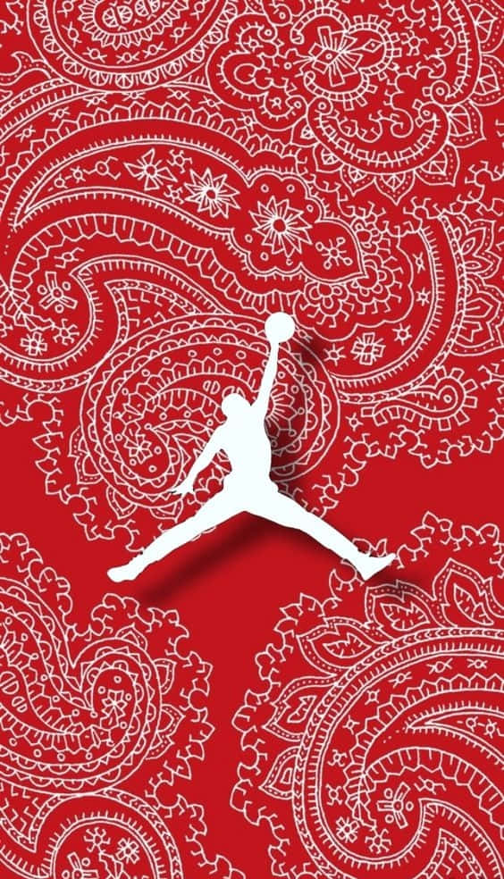 Paisley 桌布 壁紙 — 一個白色剪影，描繪籃球運動員在半空中灌籃，背景為大膽的紅色，帶有複雜的白色佩斯利圖案。