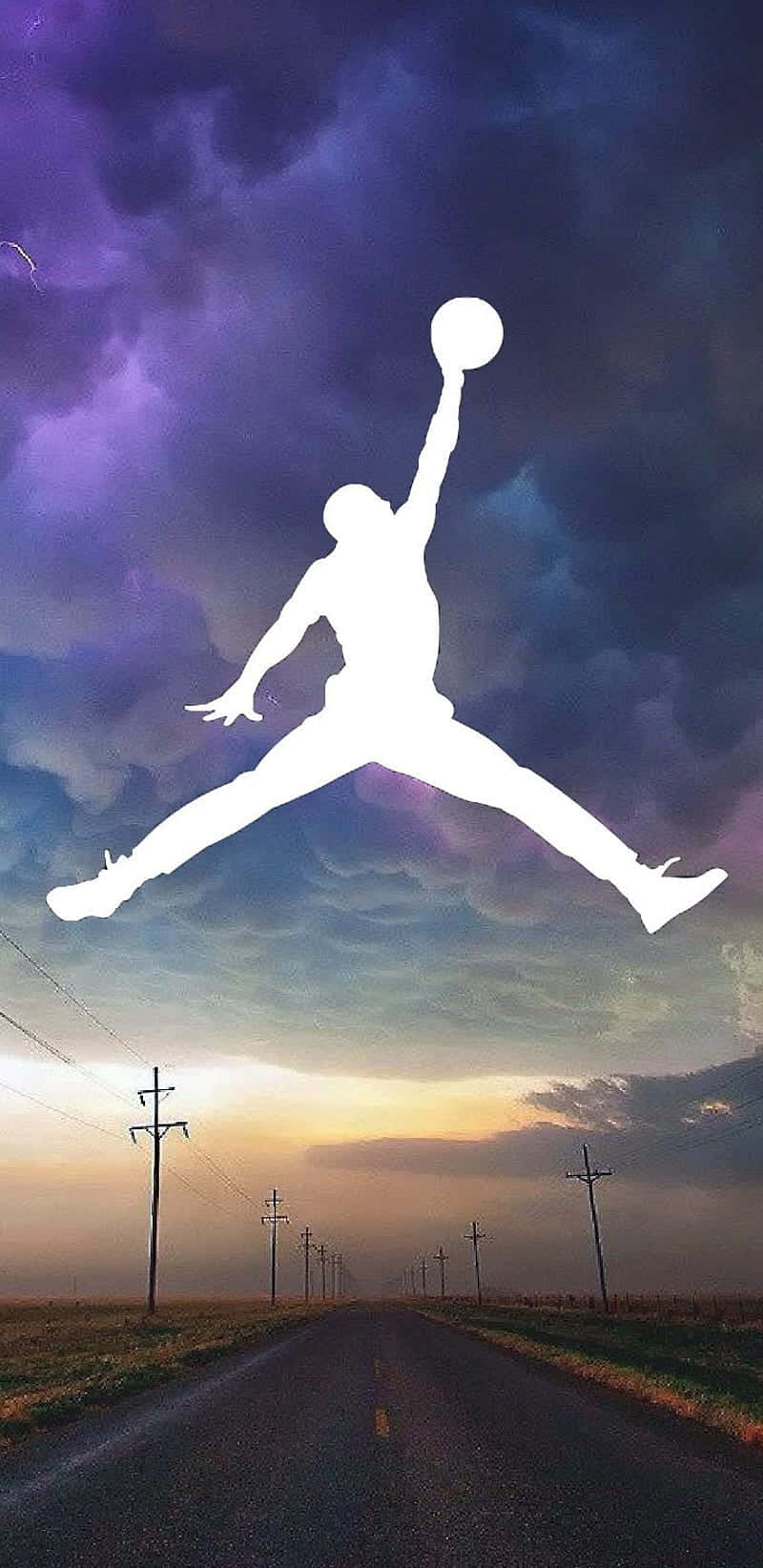 Jordan Logo Phone 桌布 壁紙 — 一個白色剪影，籃球運動員在半空中持球，下方是漫長的鄉村道路，背景是戲劇性的紫色和橙色天空。