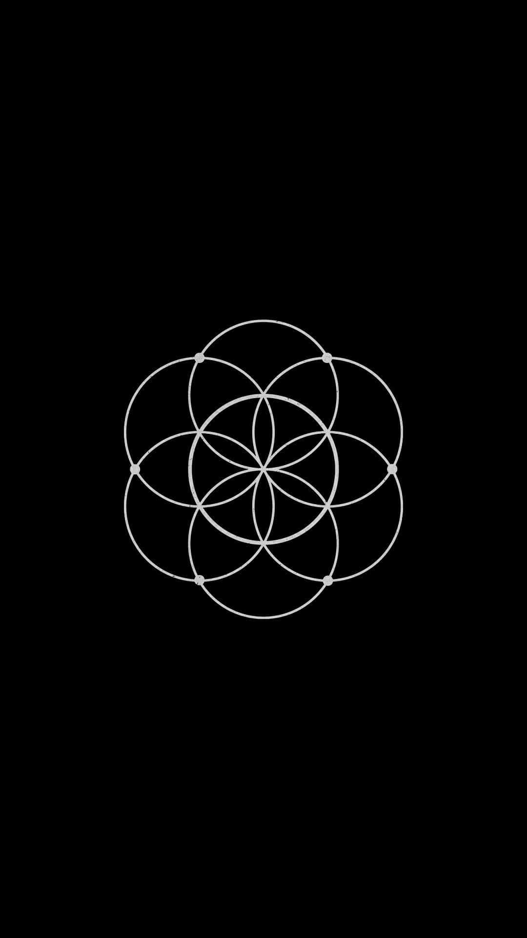 Pagan 桌布 壁紙 — 一個白色的生命之花幾何符號，居中放置在純黑色背景上。