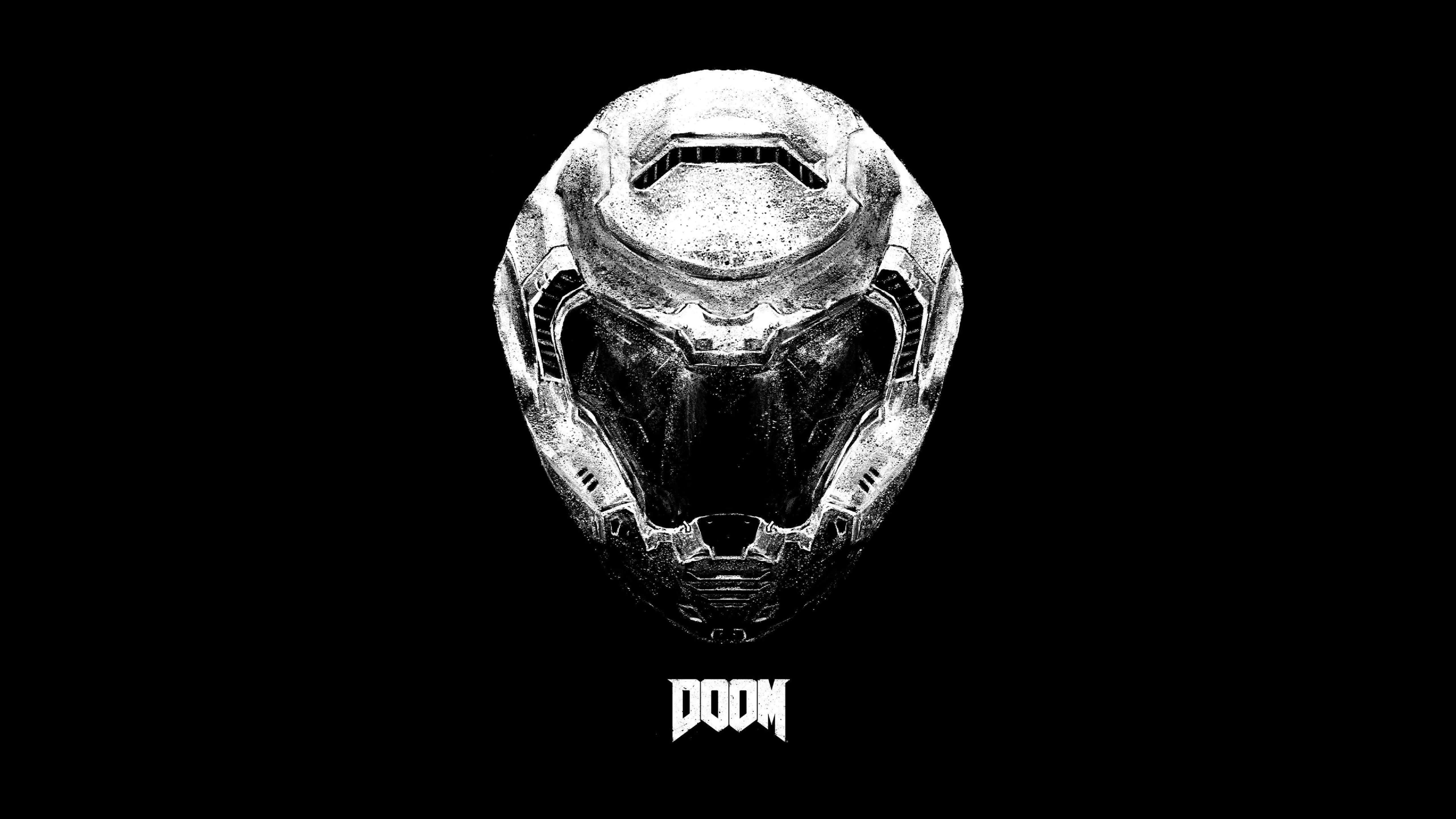 Doomguy 桌布 壁紙 — 一個白色紋理清晰的頭盔，發光的眼睛直視前方，黑色背景下方有DOOM字樣。