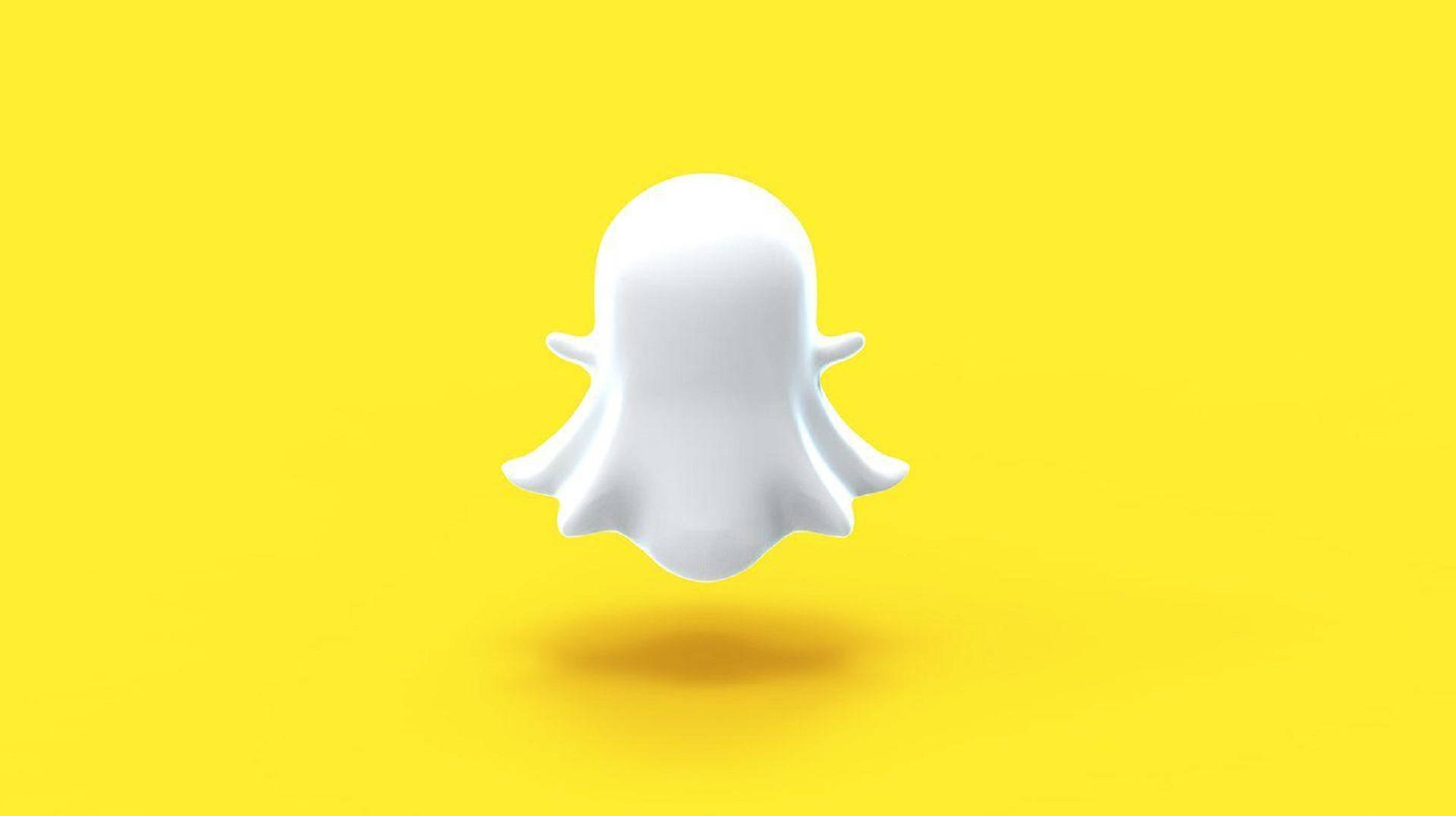 Snapchat 桌布 壁紙 — 一個白色鬼魂標誌漂浮在明亮的黃色背景上，帶有柔和陰影。
