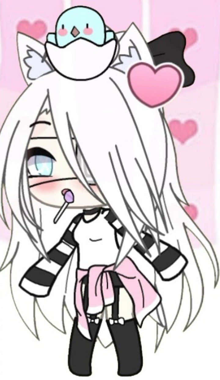 Gacha 桌布 壁紙 — 一個白髮貓耳的可愛動漫女孩，拿著棒棒糖，一隻藍色小鳥停在她頭上，背景是粉紅色的心形圖案。