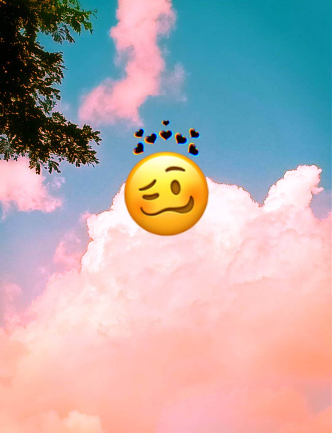 Black Emoji 桌布 壁紙 — 一個眨眼的表情符號，帶有漂浮的心形，懸浮在粉紅色的雲朵之上，背景是藍天，角落有樹枝。