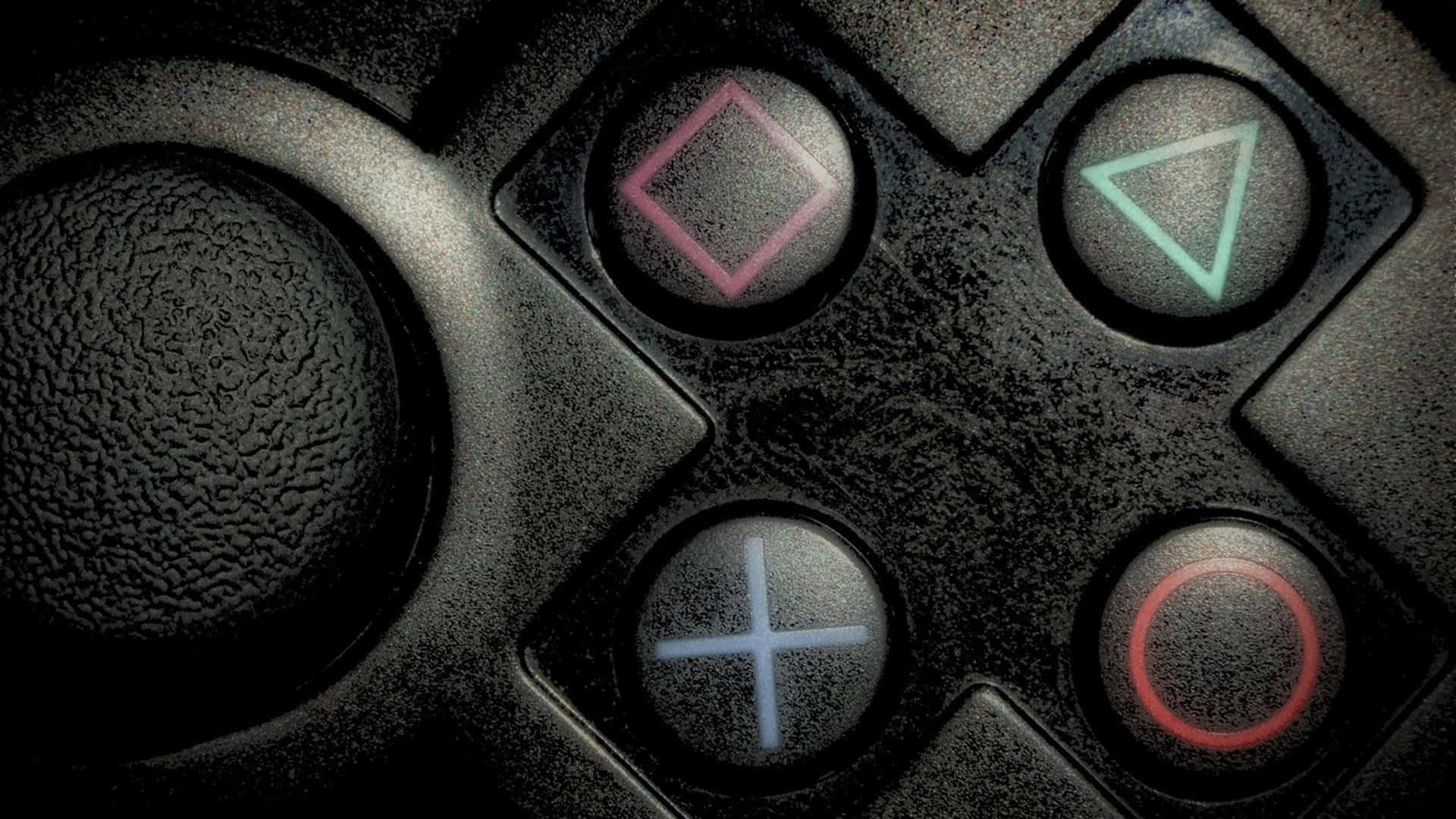 Ps Vita 桌布 壁紙 — 一個磨損的黑色遊戲控制器特寫，帶有發光的粉紅色、綠色、藍色和紅色動作按鈕。