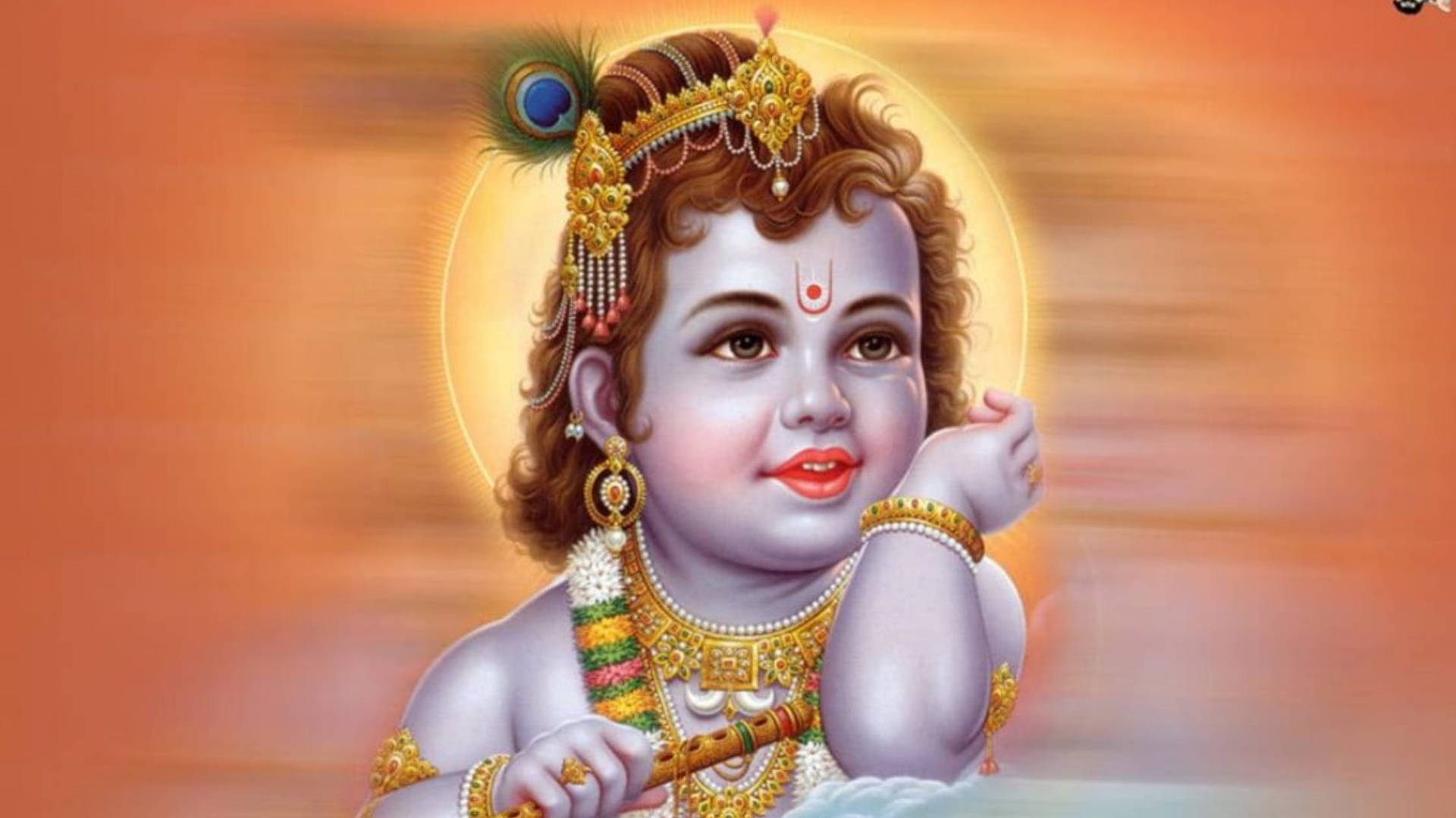 cute krishna 桌布 壁紙 — 一個神聖的孩子，捲曲的頭髮上裝飾著珠寶和孔雀羽毛，在光芒四射的金色光環前握著一支笛子。