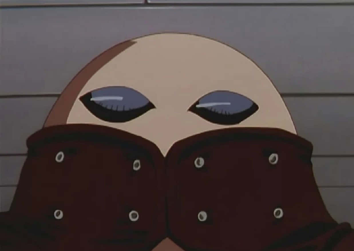 Trigun Gray The Ninelives 桌布 壁紙 — 一個禿頭動漫角色的大特寫，大眼睛從深棕色銀扣外套上方偷看。