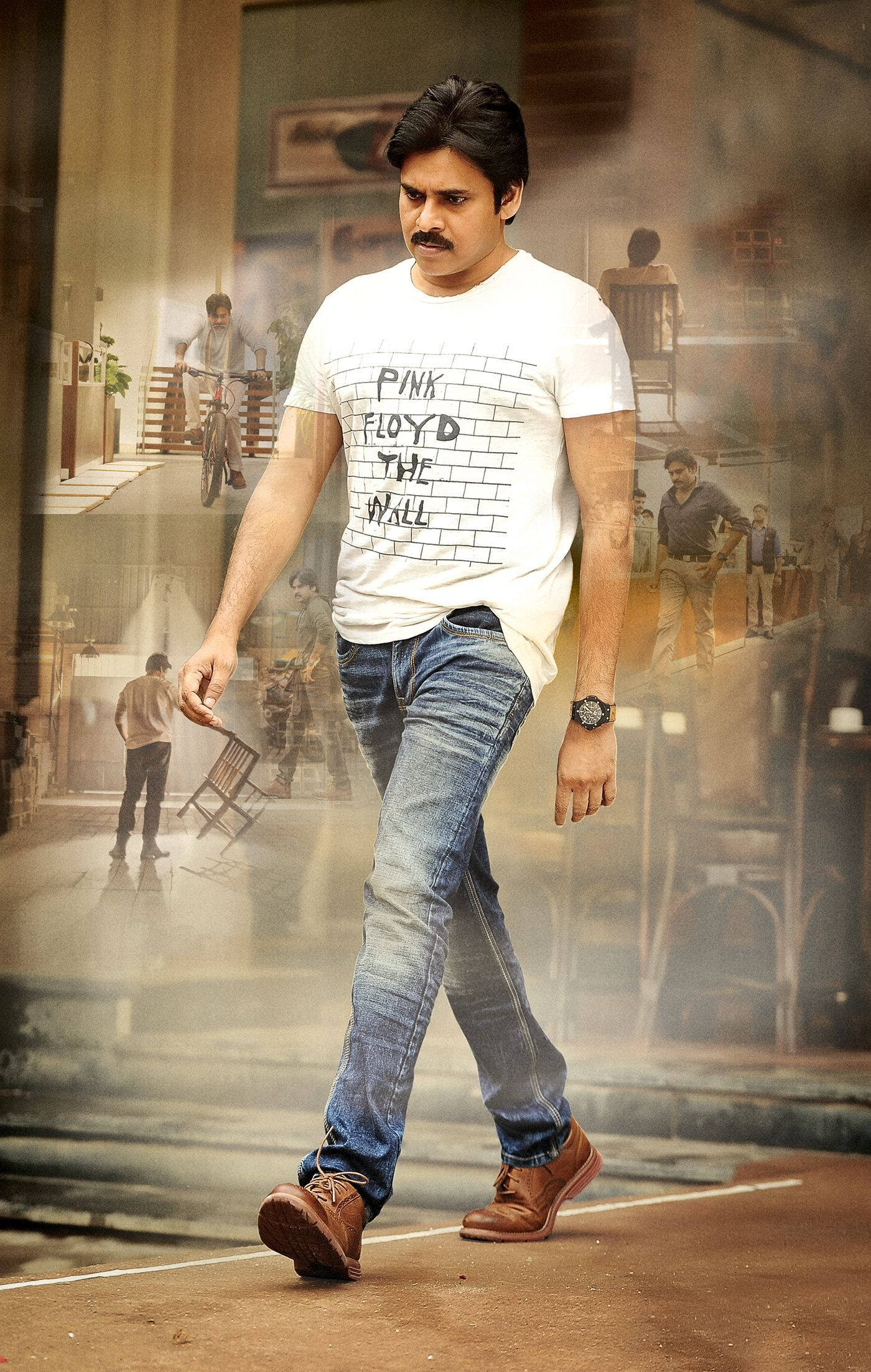 Pawan Kalyan 桌布 壁紙 — 一個穿著Pink Floyd T恤和牛仔褲的男人自信地走過一個分層的城市場景，背景中有幽靈般的人物。