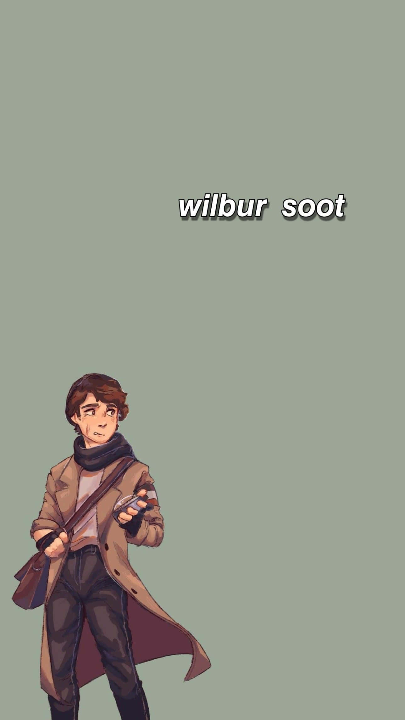 Wilbur Soot 桌布 壁紙 — 一個穿著棕色外套和圍巾的年輕男子，在柔和的綠色背景前拿著一個裝置，上面寫著他的名字。