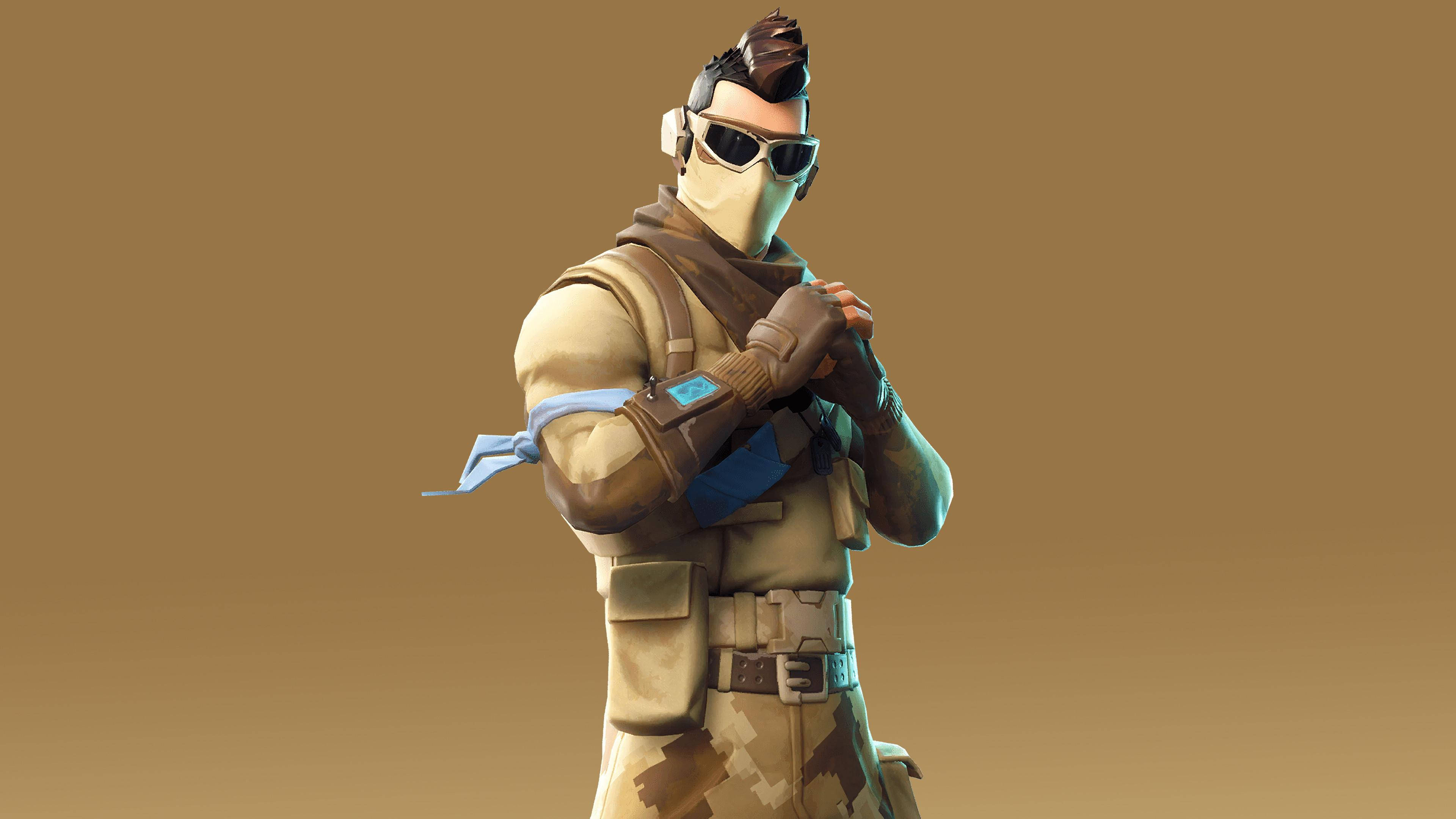 Fortnite Skins 桌布 壁紙 — 一個穿著沙漠裝備的Fortnite角色自信地站在純棕色背景前。