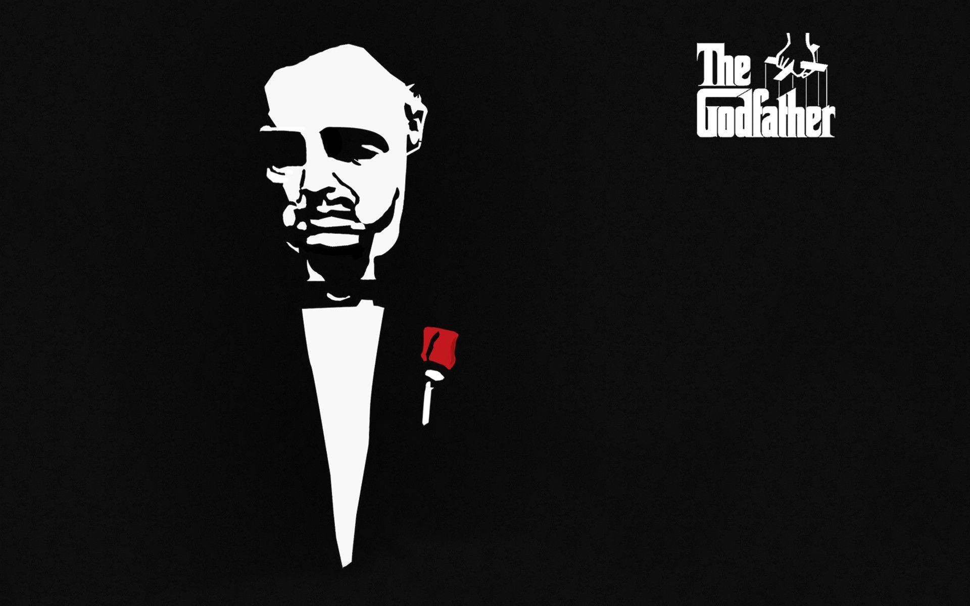 Godfather 桌布 壁紙 — 一個穿著燕尾服的男人，在黑色背景上佩戴紅色玫瑰胸花的鮮明黑白剪影。