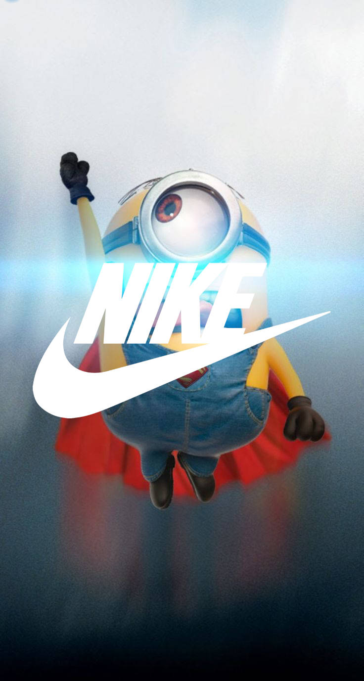 Cool Nike 桌布 壁紙 — 一個穿著牛仔吊帶褲和紅色披風的迷你兵，單臂高舉向上飛翔，一個巨大的白色Nike swoosh標誌覆蓋在他的身體上，背景是明亮的藍天。