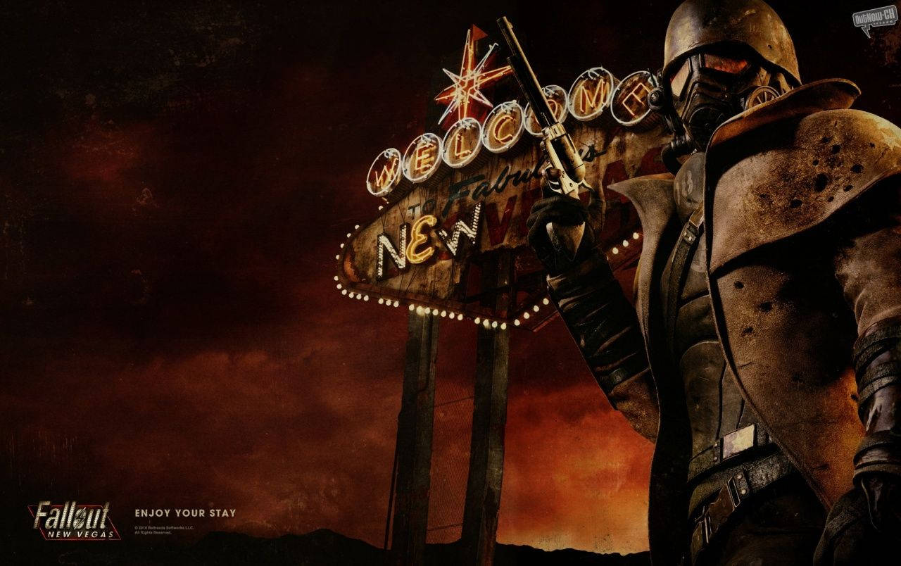 New 桌布 壁紙 — 一個穿著破爛盔甲的末世廢土戰士站在閃爍的「Welcome to New Vegas」標誌前，天空是血橙色。