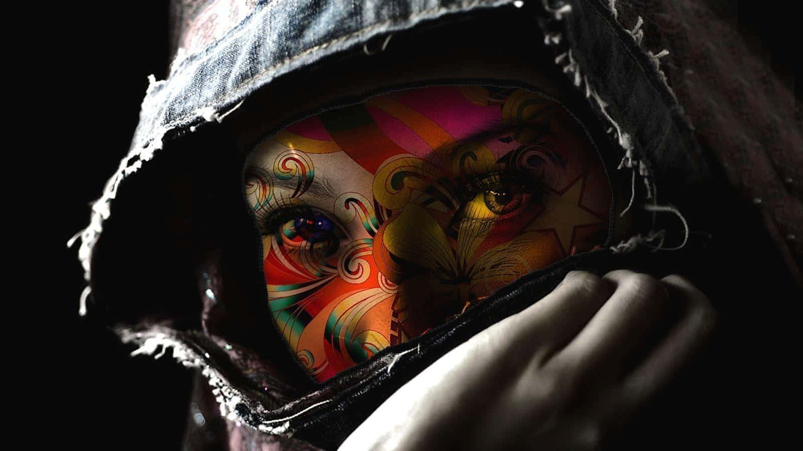 Tattoo 桌布 壁紙 — 一個穿著破舊連帽衫的人，在黑暗的背景下露出了一張色彩鮮豔、帶有漩渦圖案和發光眼睛的臉。