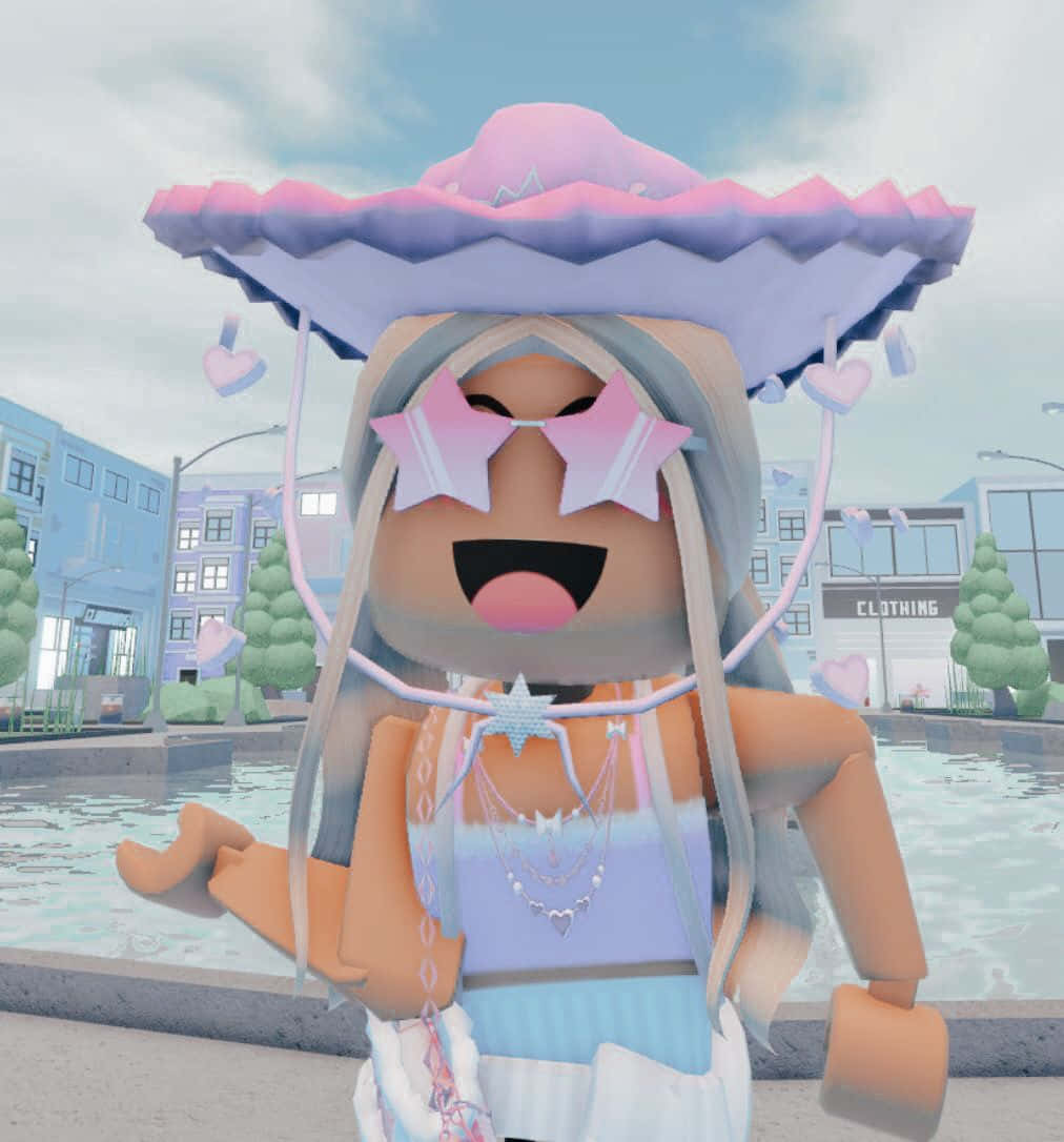 Roblox Character 桌布 壁紙 — 一個穿著粉彩粉藍色服裝和超大帽子的 Roblox 角色，愉快地站在風格化的城市廣場上。