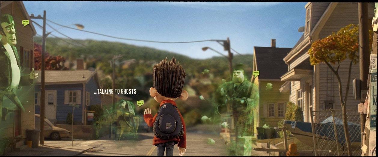 Animated 桌布 壁紙 — 一個穿著紅色外套的小男孩站在郊區街道上，與在晴朗藍天下漂浮在房屋之間的半透明綠色幽靈交談。