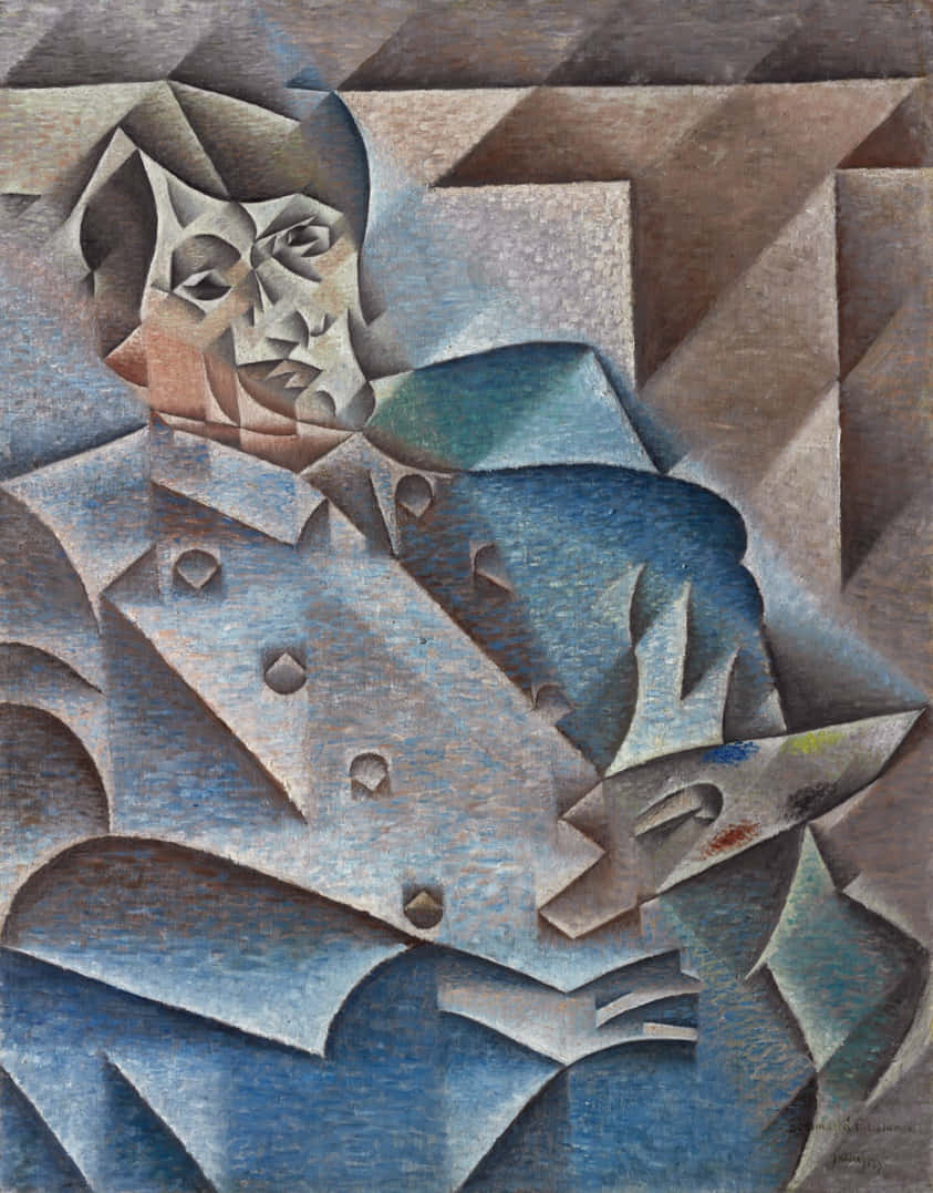 Picasso 桌布 壁紙 — 一個穿著藍色外套的男人的碎片化立體主義肖像，以柔和的泥土色調和幾何平面呈現。