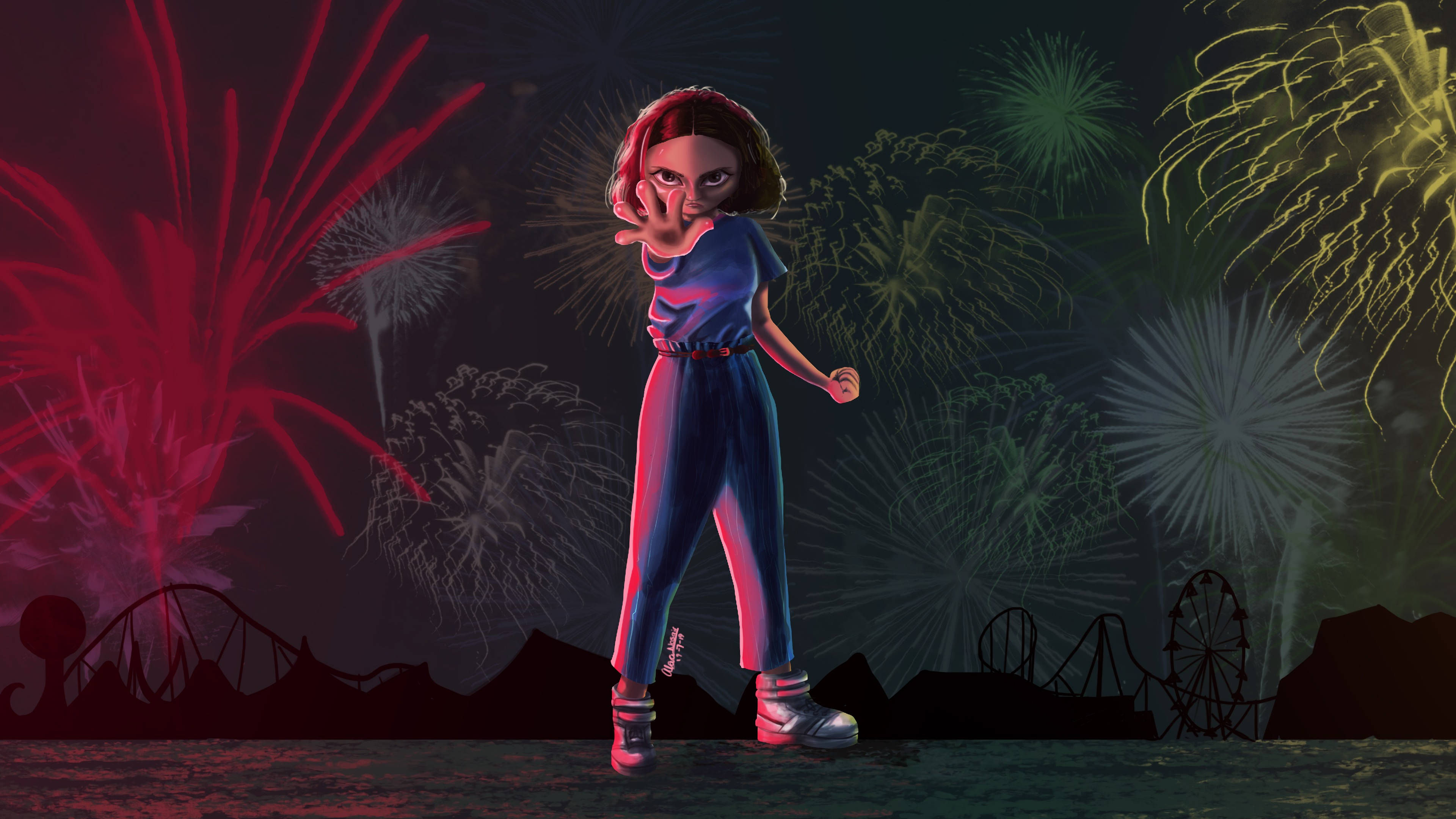 Aesthetic Stranger Things Eleven 桌布 壁紙 — 一個穿著藍色連身褲的風格化女孩站在黑暗的天空前，天空被鮮豔的紅色、綠色和黃色煙火照亮，下方有雲霄飛車的剪影。