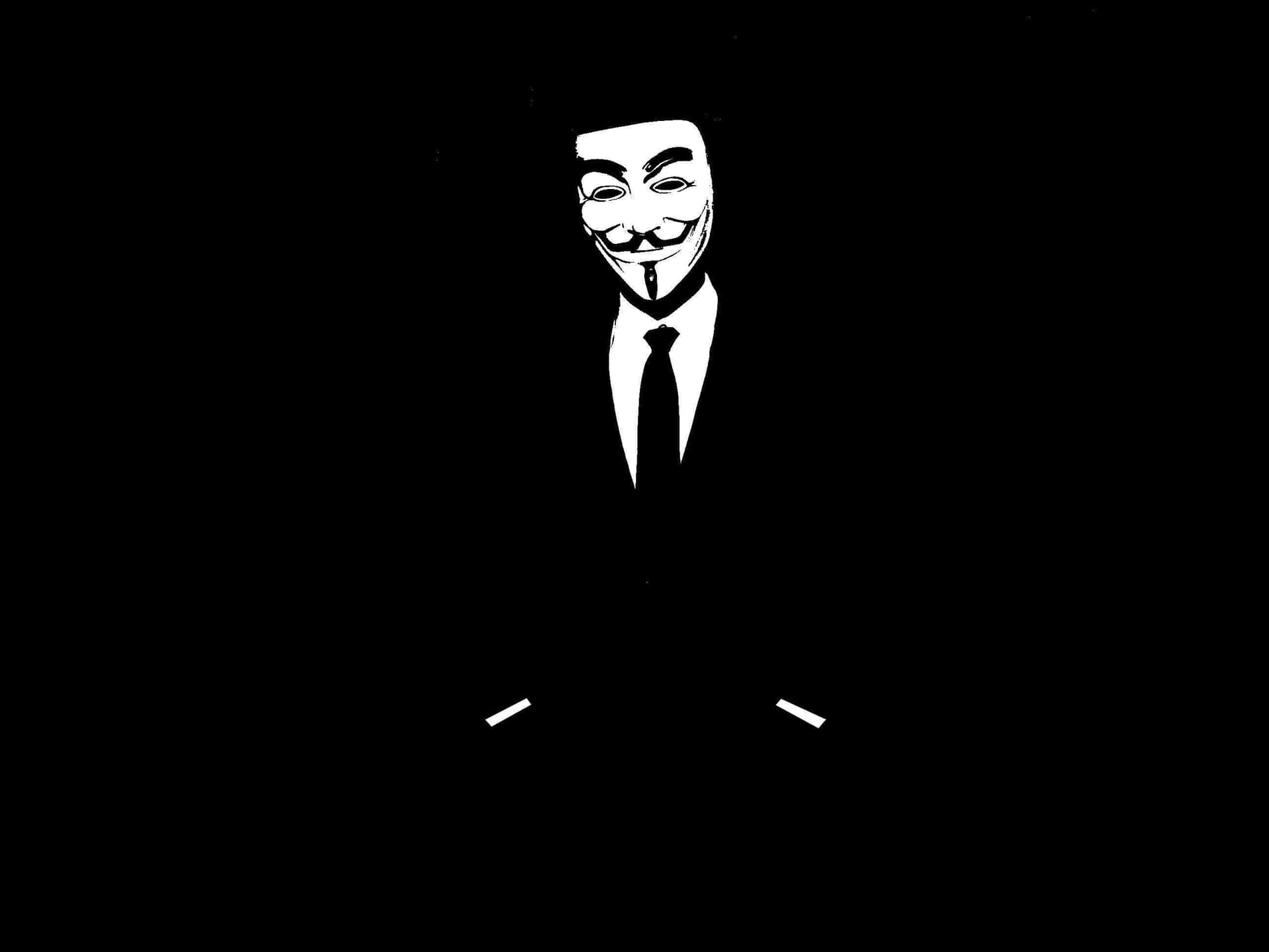 一個穿著西裝打領帶、戴著蓋伊·福克斯面具的人，在黑色背景上。 — 匿名 GIF 壁紙