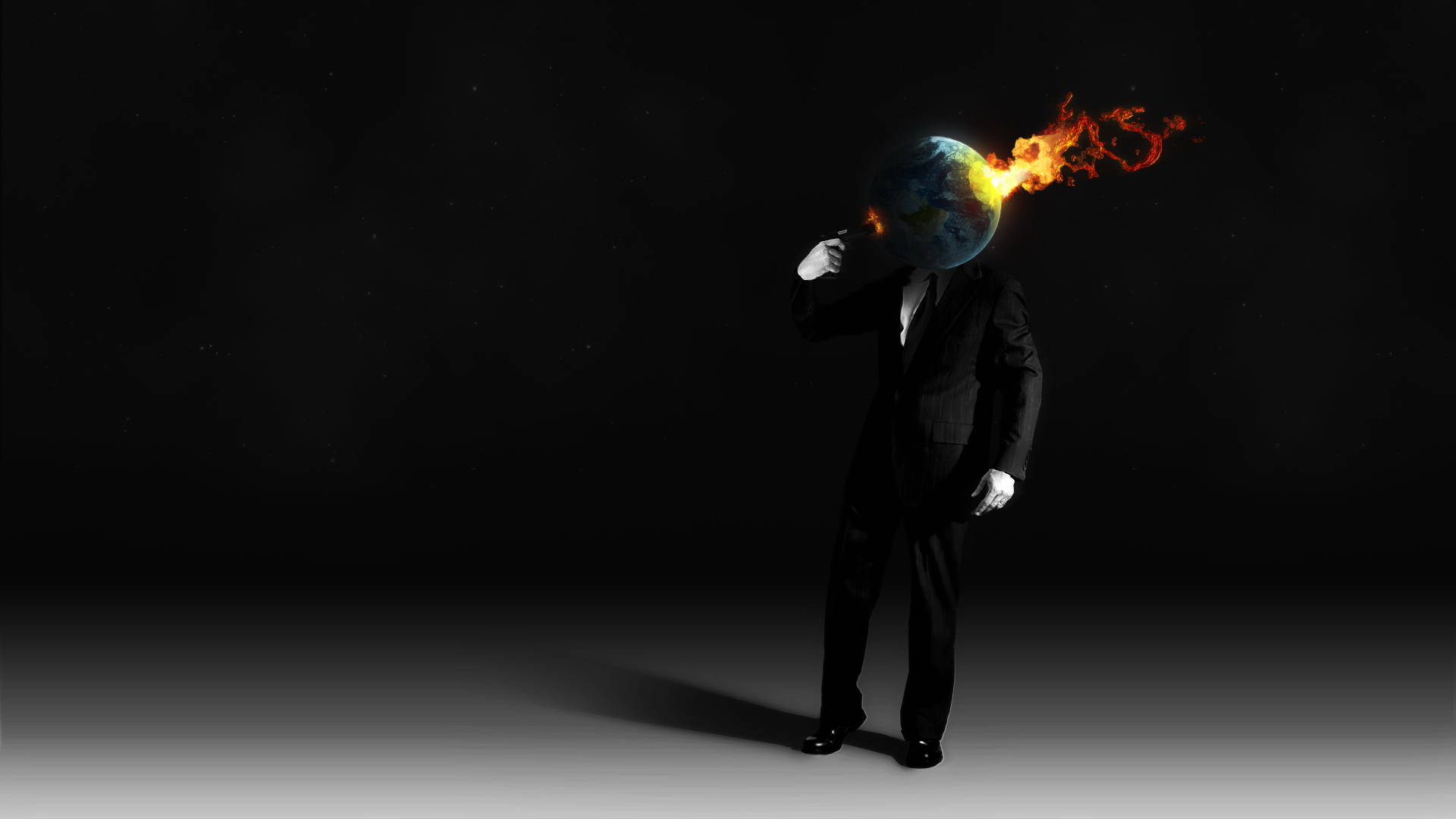 artwork 桌布 壁紙 — 一個穿著西裝的人物站在黑暗虛空中，手持一個燃燒的地球代替頭部。
