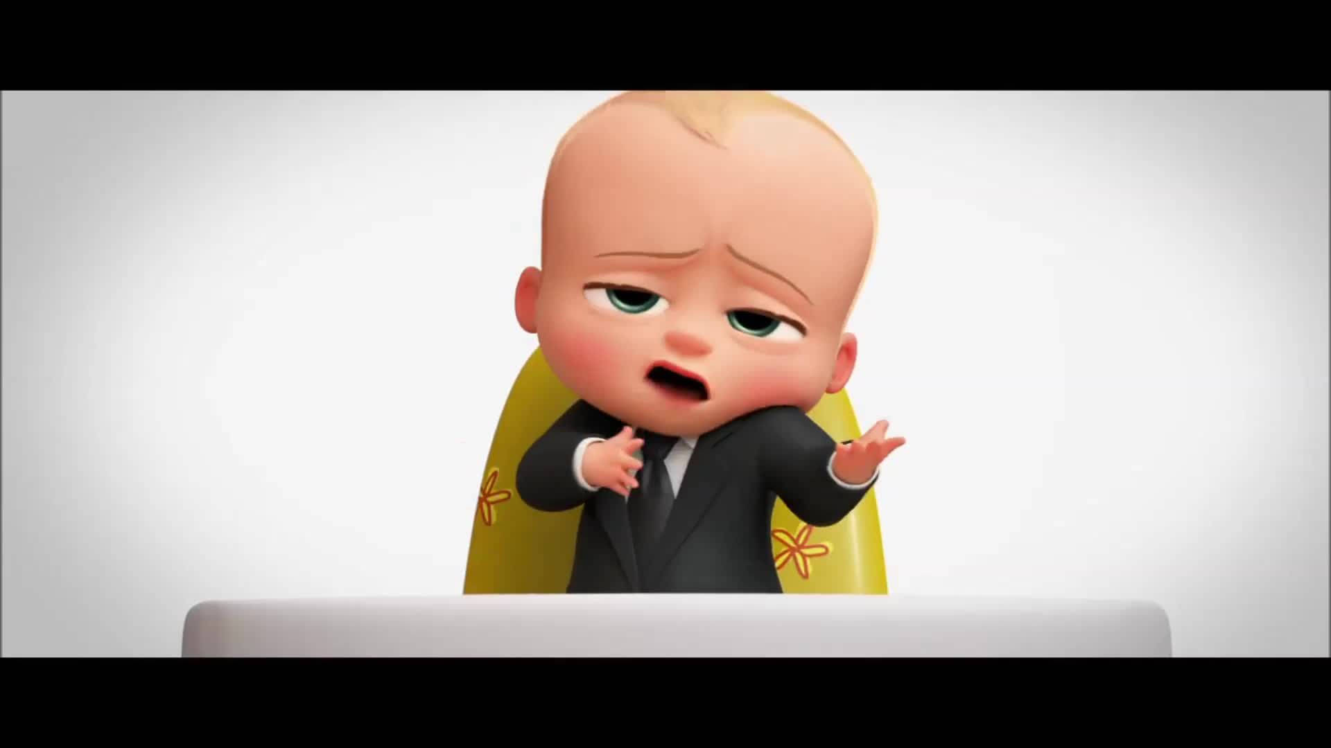 boss 桌布 壁紙 — 一個穿著西裝的卡通嬰兒坐在黃色椅子上，對著筆記型電腦顯得沮喪。