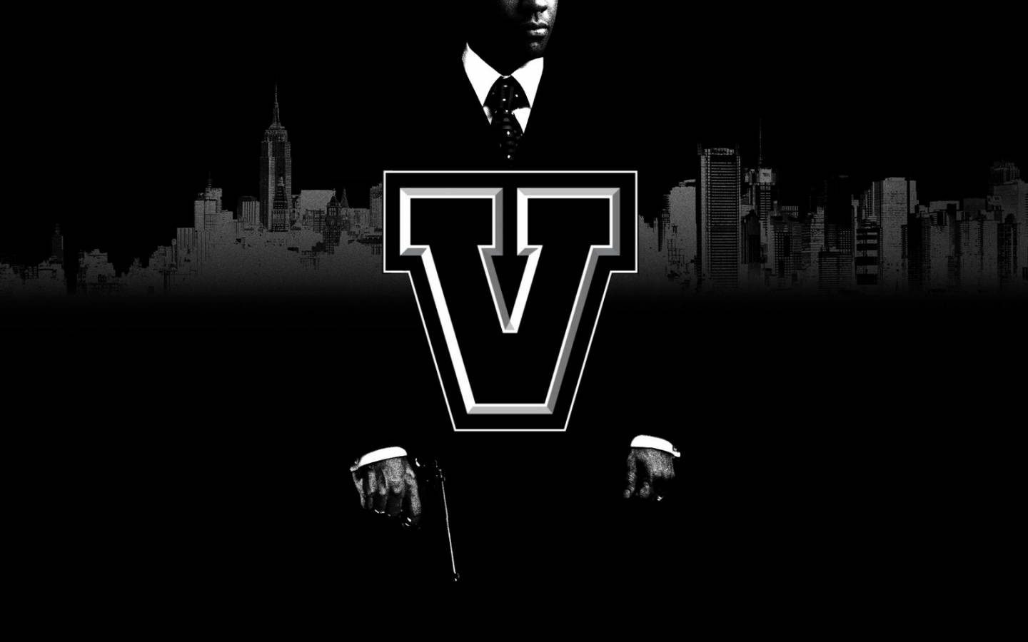 v 桌布 壁紙 — 一個穿著西裝的男人的單色剪影站在城市天際線前，前面中央有一個大型風格化的V標誌。