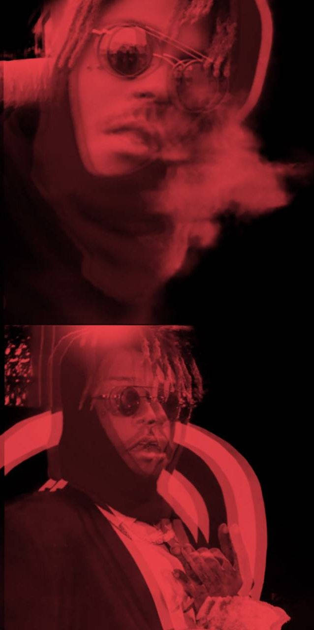 穿著連帽衫和太陽眼鏡的人在紅光下呼出煙霧。 — Juice Wrld 壁紙