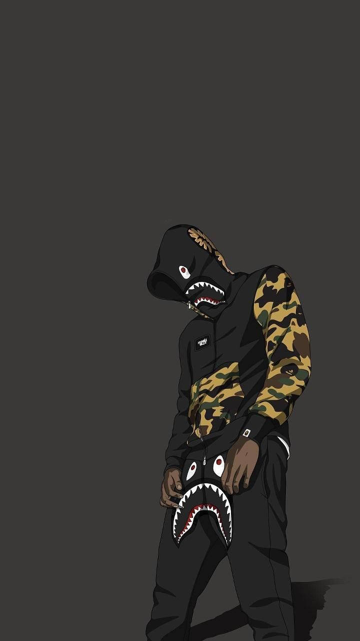 Hoodie 桌布 壁紙 — 一個穿著黑色連帽衫和迷彩袖的風格化人物，站在深灰色背景前，穿著帶有鯊魚嘴的服裝。