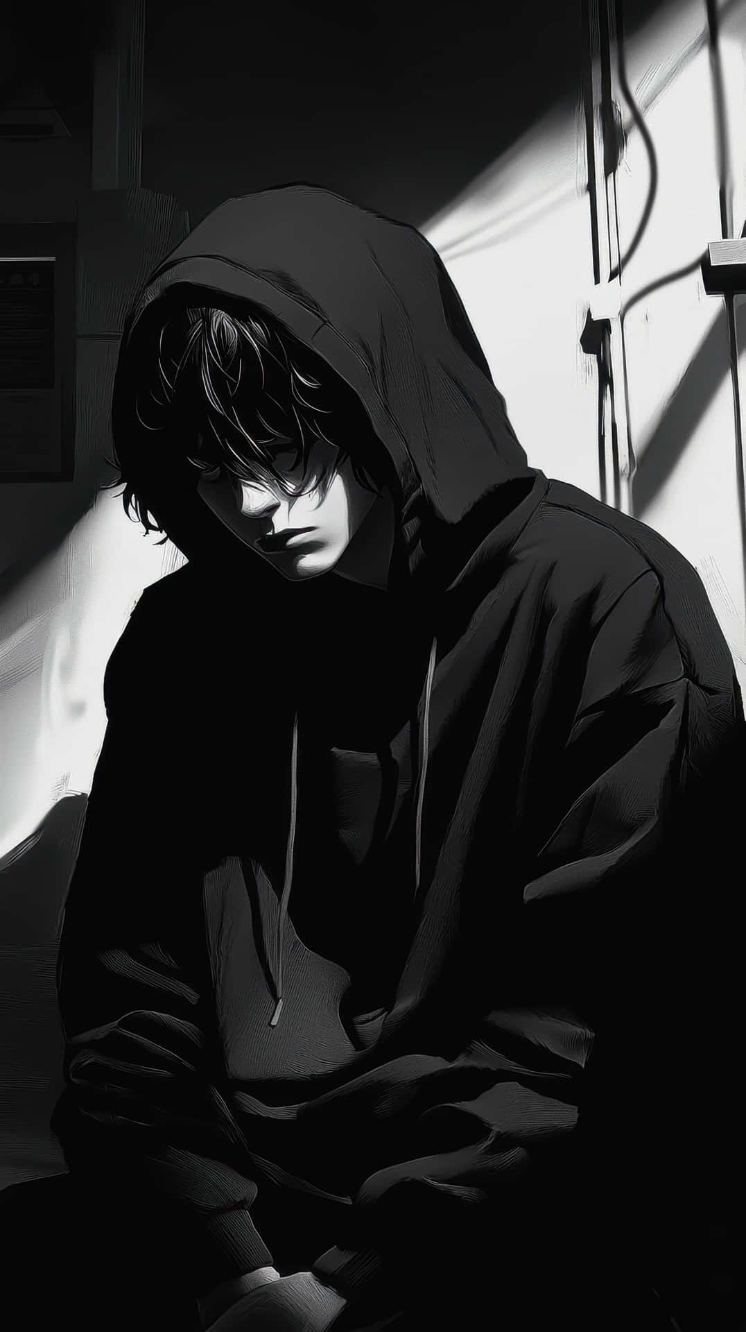 Moody monochrome anime-style portrait of a thoughtful man in a hoodie 壁紙 — 一個穿著黑色連帽衫的年輕人坐在陰影中，一道光束照亮了他們的臉和肩膀。