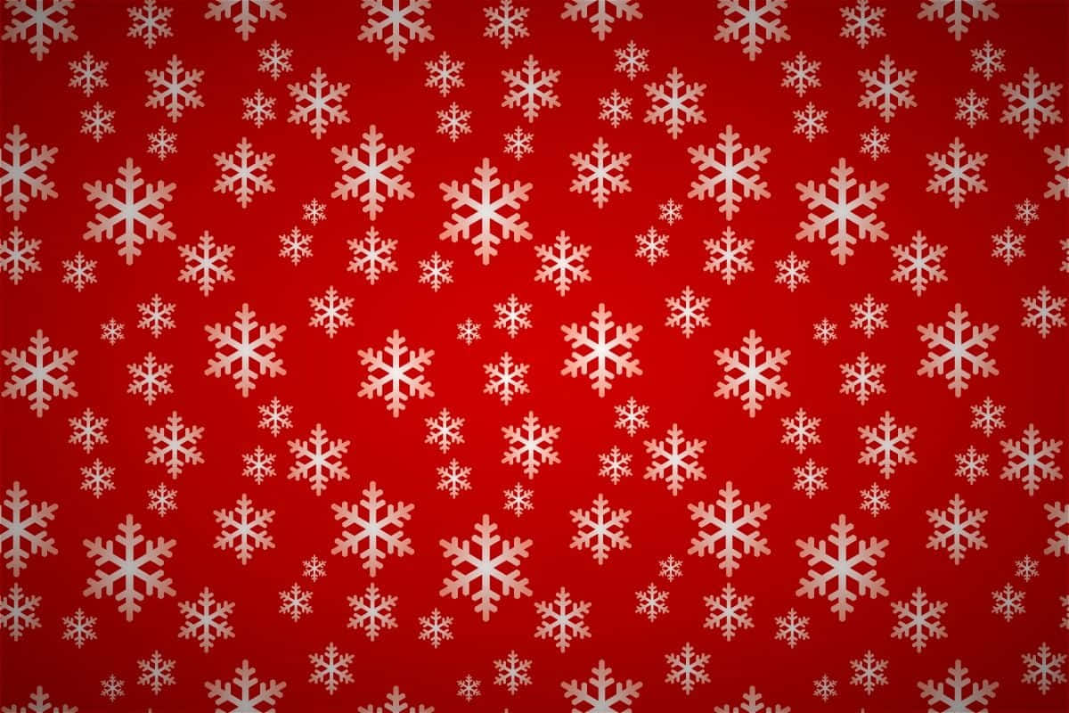 Christmas Pattern 桌布 壁紙 — 一個節日紅色背景，點綴著散落的白色雪花，大小不一，設計精緻。