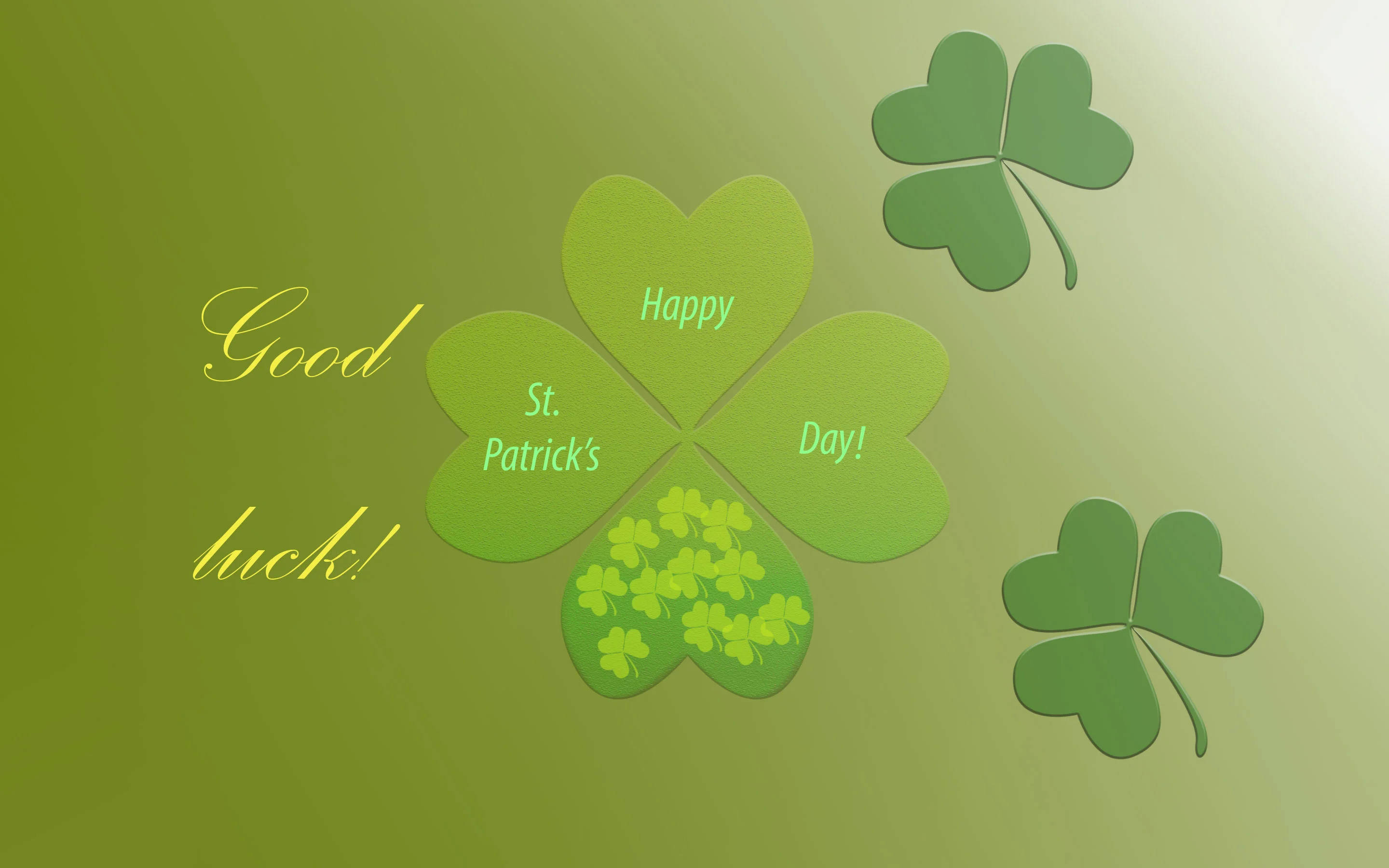 Happy St Patricks Day 桌布 壁紙 — 一個節日風格的綠色四葉草，帶有「Happy St. Patrick's Day!」文字和較小的三葉草，背景為綠色漸層。