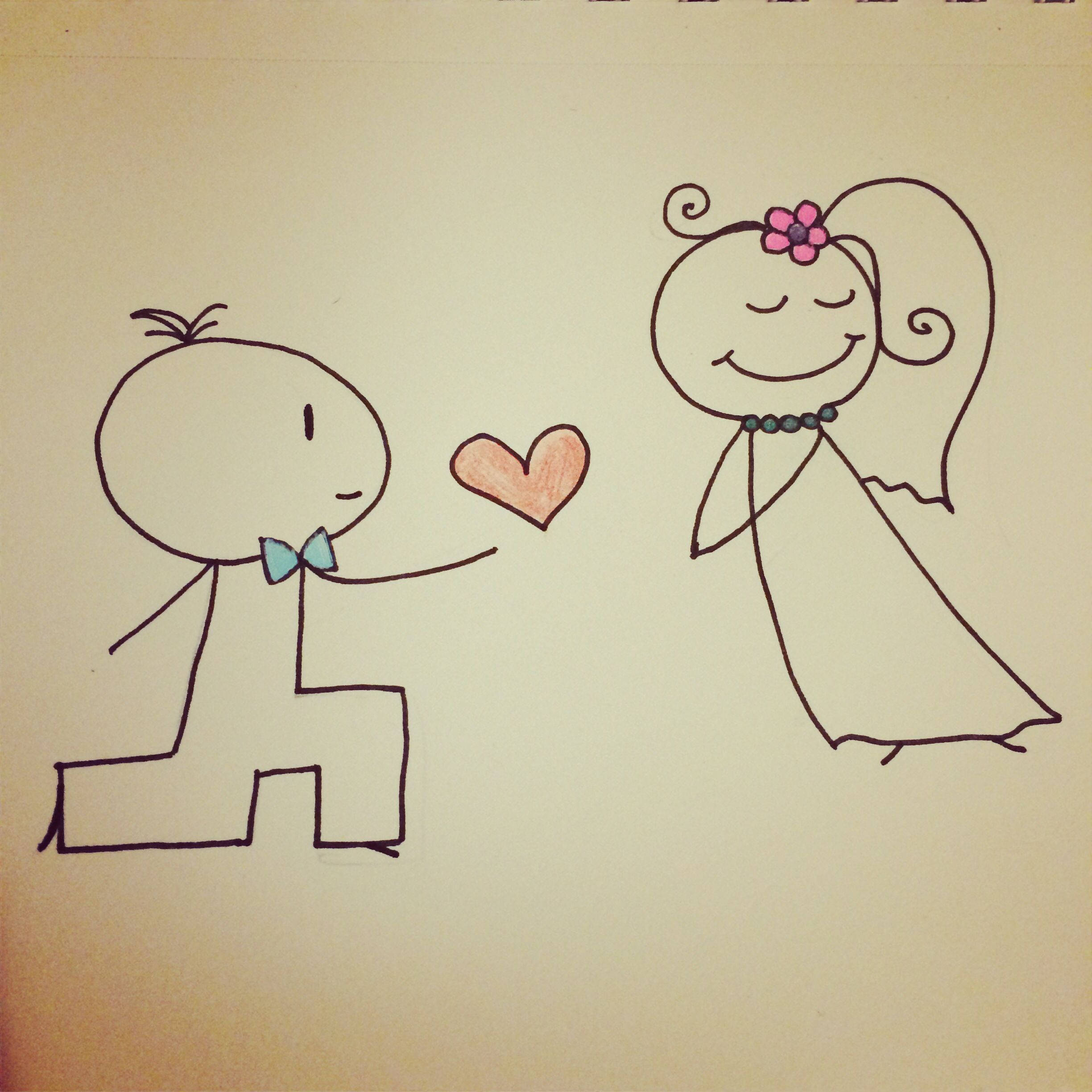 Love Drawings 桌布 壁紙 — 一個簡單的火柴人圖畫顯示新郎跪下，向一位頭髮上插著花、微笑的新娘獻上心形。