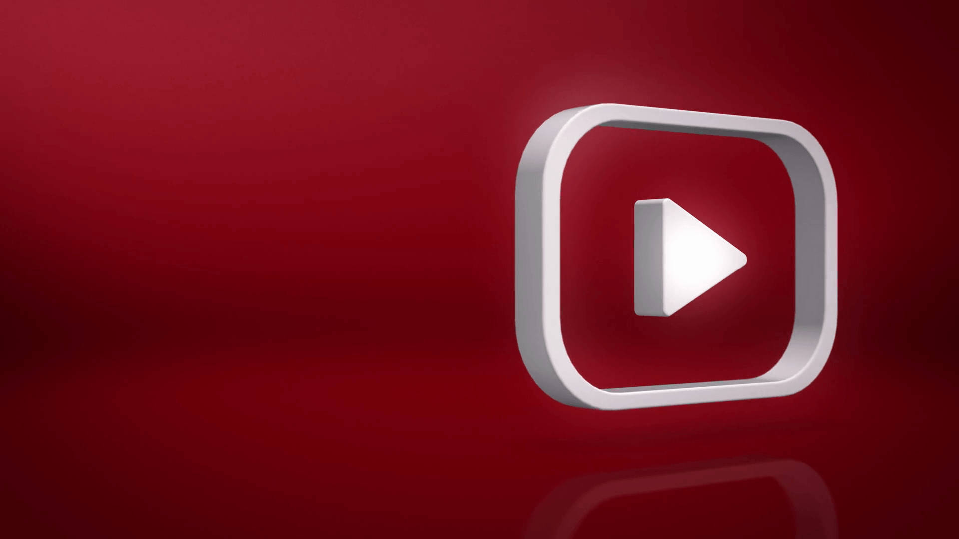 YouTube 桌布 壁紙 — 一個簡潔的白色YouTube播放按鈕圖示漂浮在豐富的紅色漸變背景上，帶有微妙的反射。